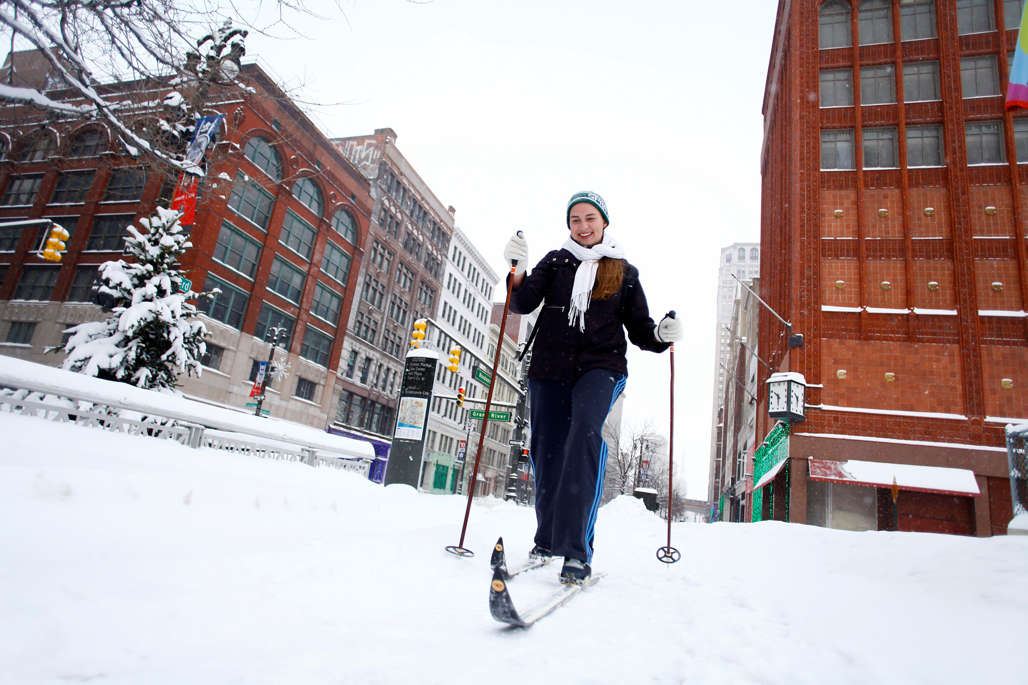 Alison Mueller skies to work through several inches of snow along Woodward Avenue as the area deals with record breaking freezing weather January 6, 2014 in Detroit, Michigan
