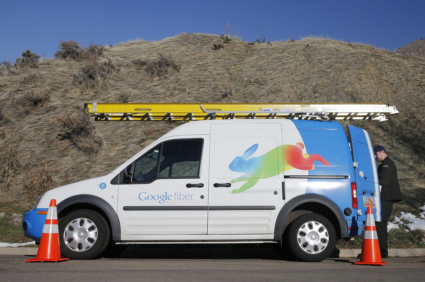 A Google Fiber technician gets supplies out of his truck to install Google Fiber in a residential home in Provo, Utah, January 2, 2014. Provo is one of three cities Google is currently building gigabit internet and television service for business and residential use.