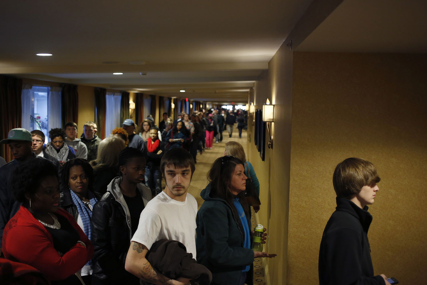 Prospective job applicants wait in line to learn about job openings at the Kentucky Kingdom Amusement Park during a job fair at the nearby Crowne Plaza Hotel in Louisville, Ky., Jan. 4, 2013. (Luke Sharett&mdash;Bloomberg/Getty Images)