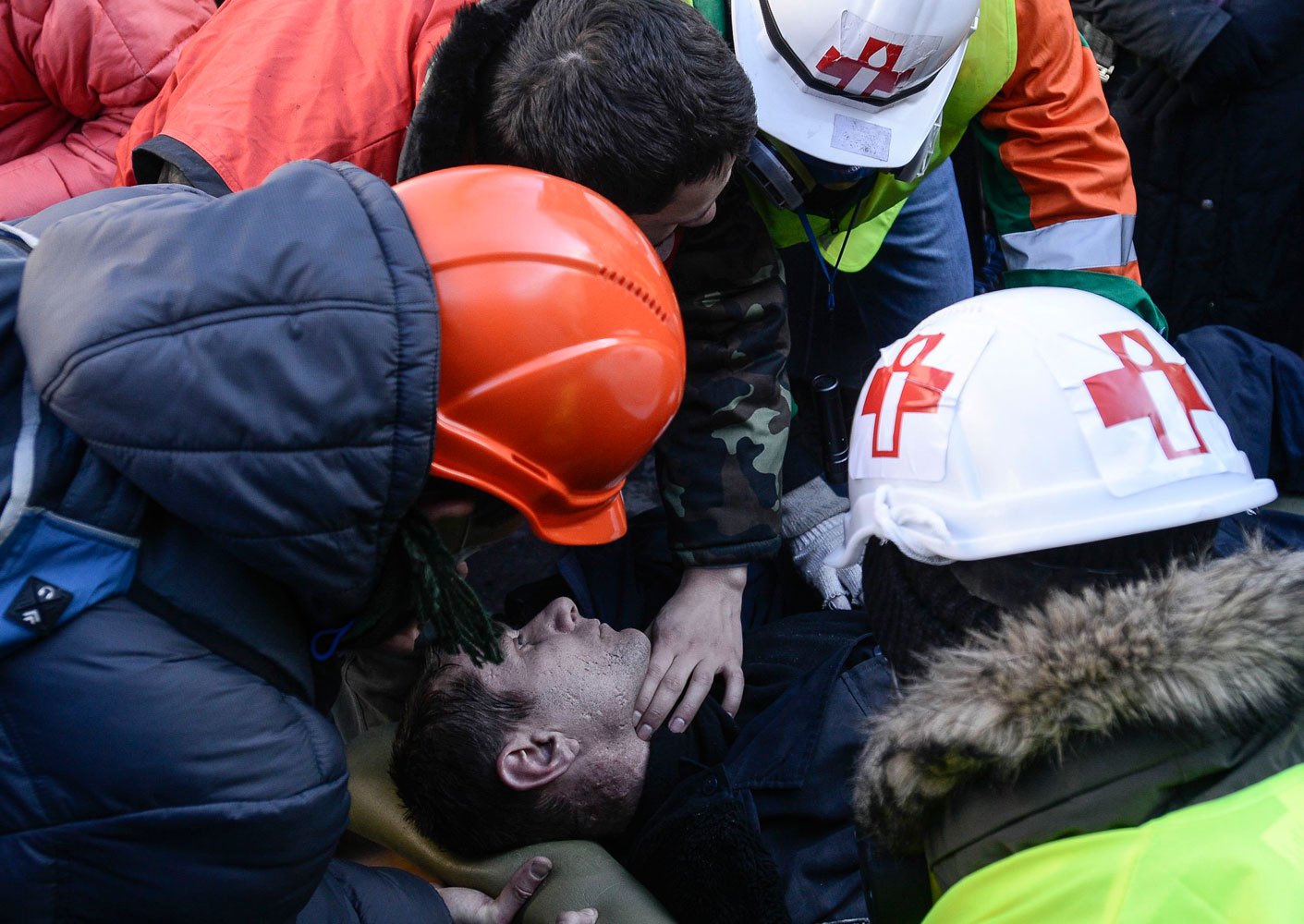An Interior Ministry member, who was injured during clashes with anti-government protesters, receives medical treatment as he lies on a stretcher in Kiev February 18, 2014.