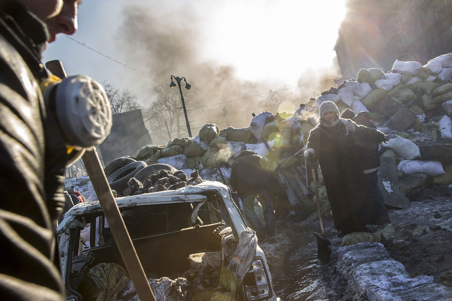 Anti-government protestors clear a channel through barricades near Dynamo Stadium on Jan. 24, 2014 in Kiev.