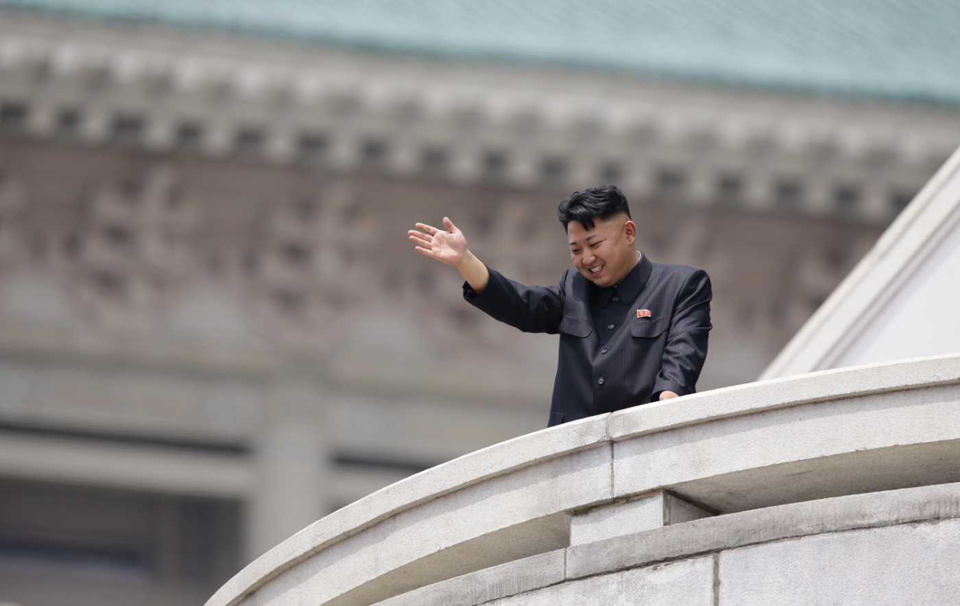 North Korean leader Kim Jong-un waves to the people during a parade to commemorate the 60th anniversary of the signing of a truce in the 1950-1953 Korean War, at Kim Il-sung Square in Pyongyang July 27, 2013. 