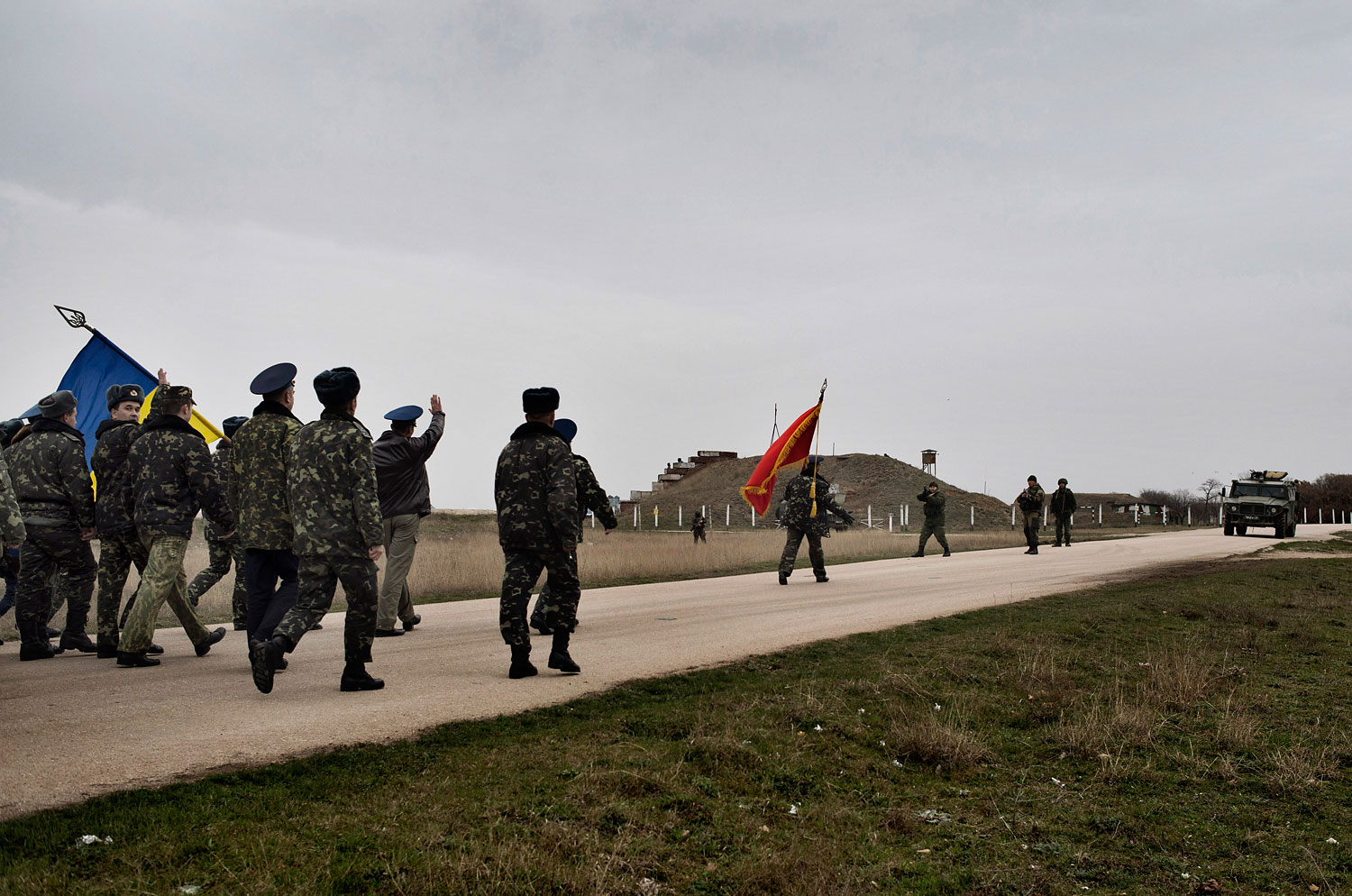 Unarmed Ukrainian soldiers approach Russian positions on the perimeter of the contested Belbek air force base in Crimea, March 4, 2014.
