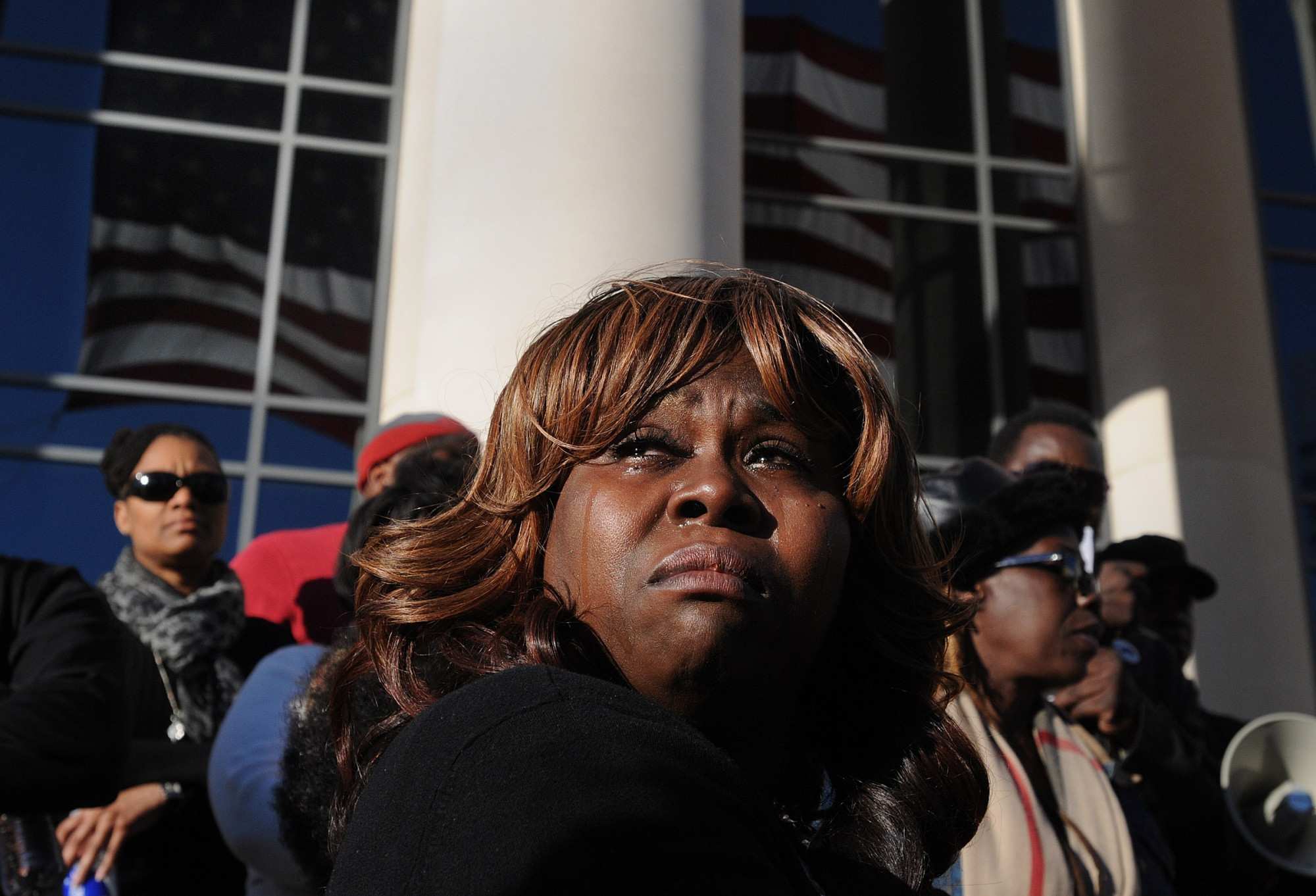 Denise Hunt tears up as she finds out the jury is deadlocked on the first-degree murder charge for Michael Dunn outside of the Duval County Courthouse as the jury enters the fourth day of deliberations, Feb. 15, 2014, in Jacksonville, Fla. (Kelly Jordan—The Florida Times-Union/AP)