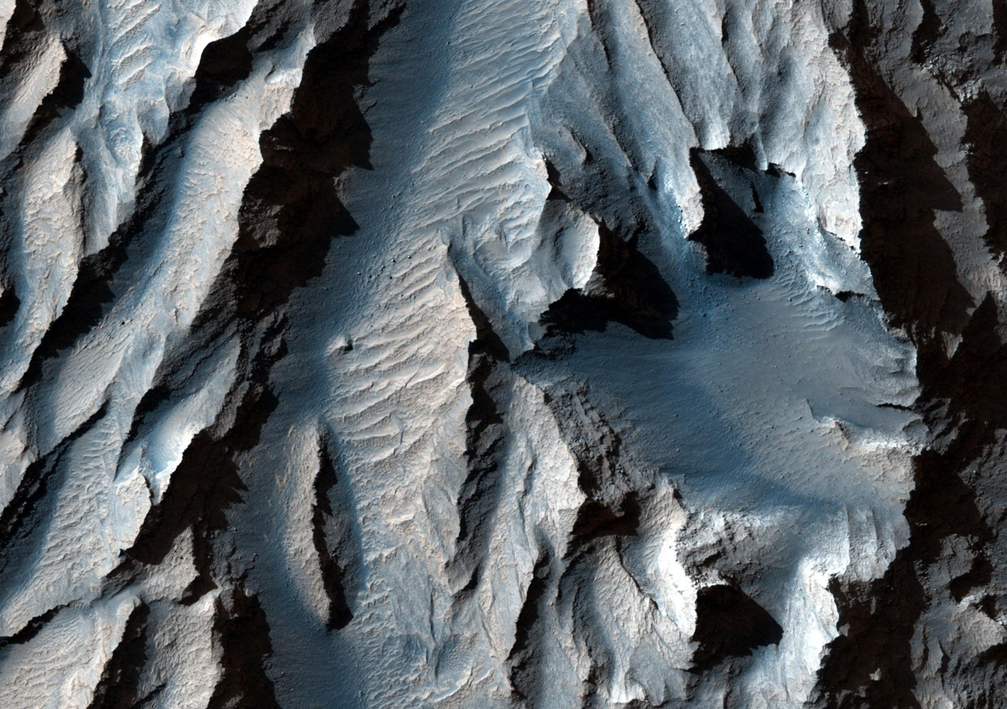 An east-facing slope in Mars's Tithonium Chasma, obtained Jan. 10, 2014, showing sediment layers of near-uniform thickness.