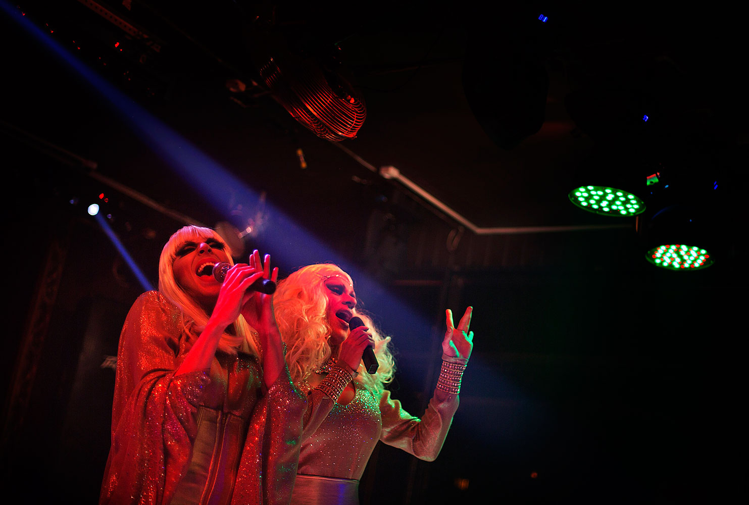 Kira, left, and Lisa, right, who would only give their stage names, perform during a show at the Mayak cabaret in Sochi, Feb. 8, 2014.