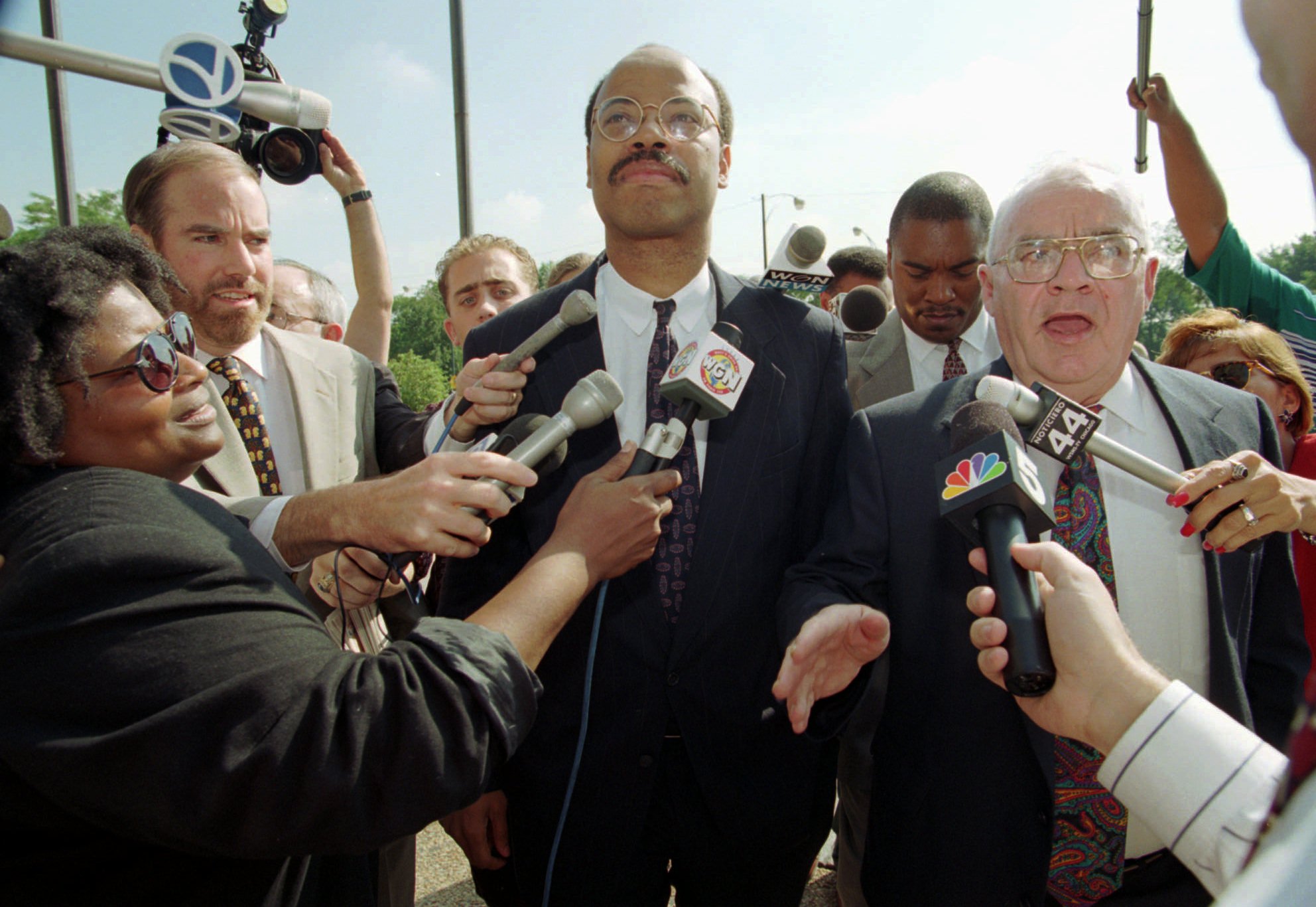 Congressman Mel Reynolds (center) and his attorney Sam Adam (right) walking to court in Chicago, Aug. 17, 1995, for the continuation of Reynold's sexual misconduct trial.