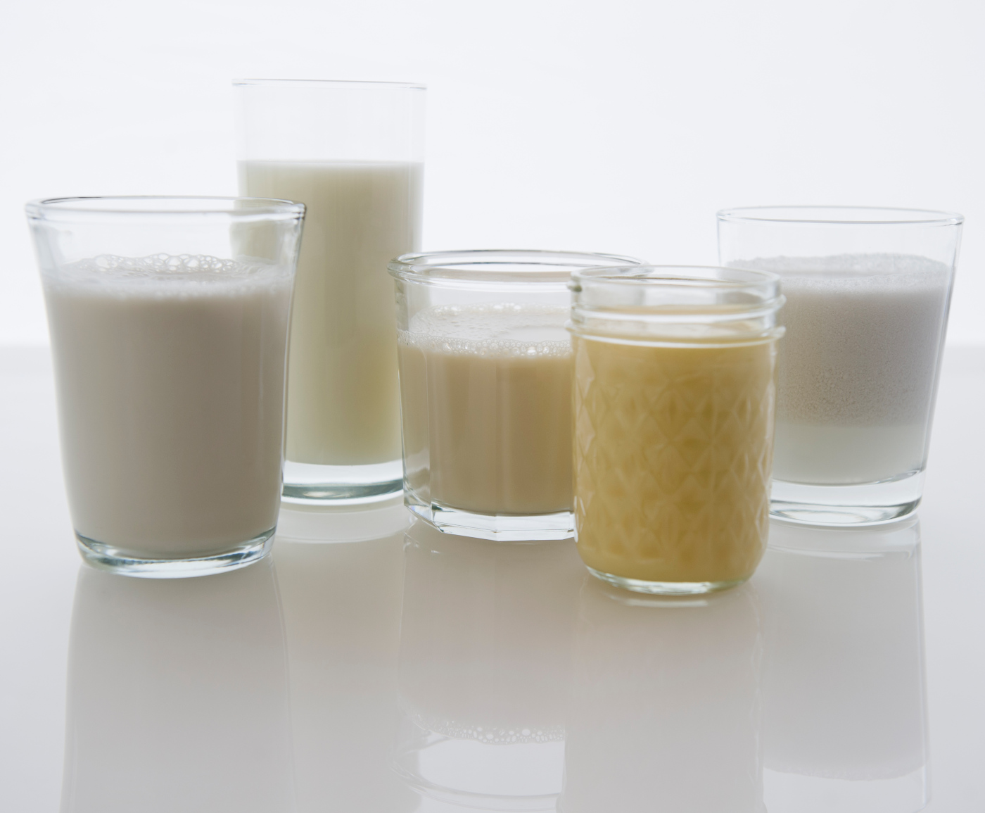 Close up of glasses with different kinds of milk