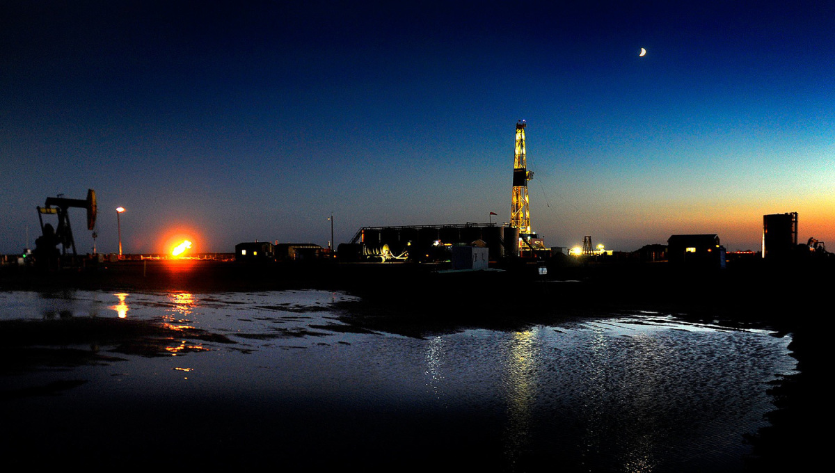 An oil drilling rig at dusk near New Town, North Dakota on June 29, 2012.