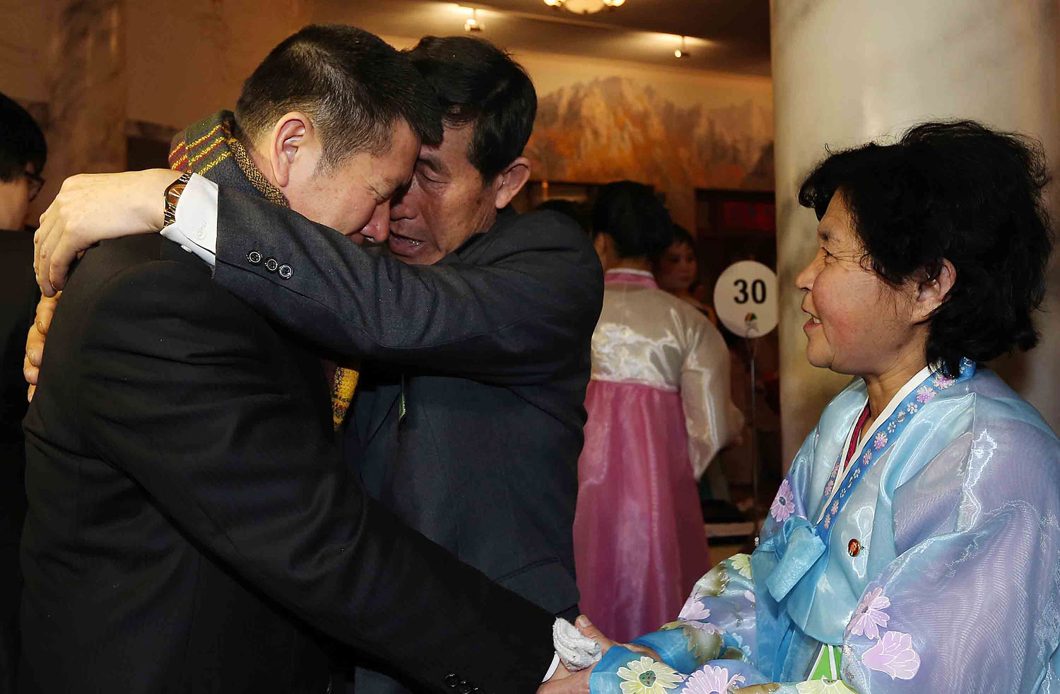 Park Yang-Kon of South Korea bids farewell to his brother Park Yang-Soo of North Korea as he prepares to depart the North Korean resort area of Mount Kumgang on the third and final day of the first group's family reunion on Feb. 22, 2014.