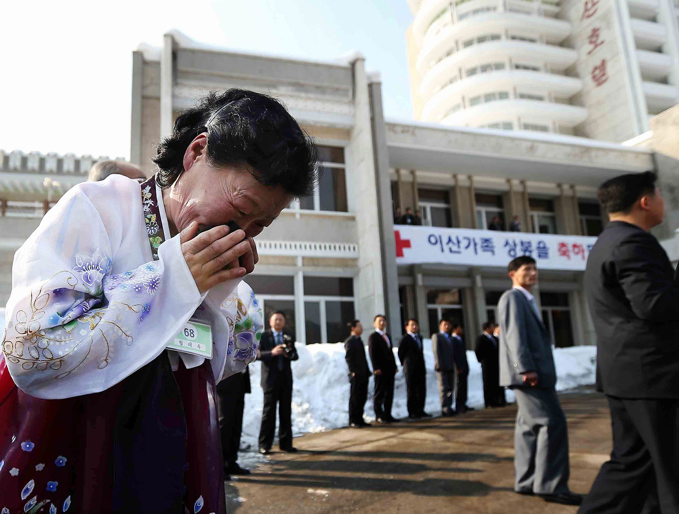 Lim Tae-Wook, a North Korean woman, sobs as she leaves her South Korean older brother after a separated family reunion meeting at Mount Kumgang resort, North Korea, Feb. 22, 2014.