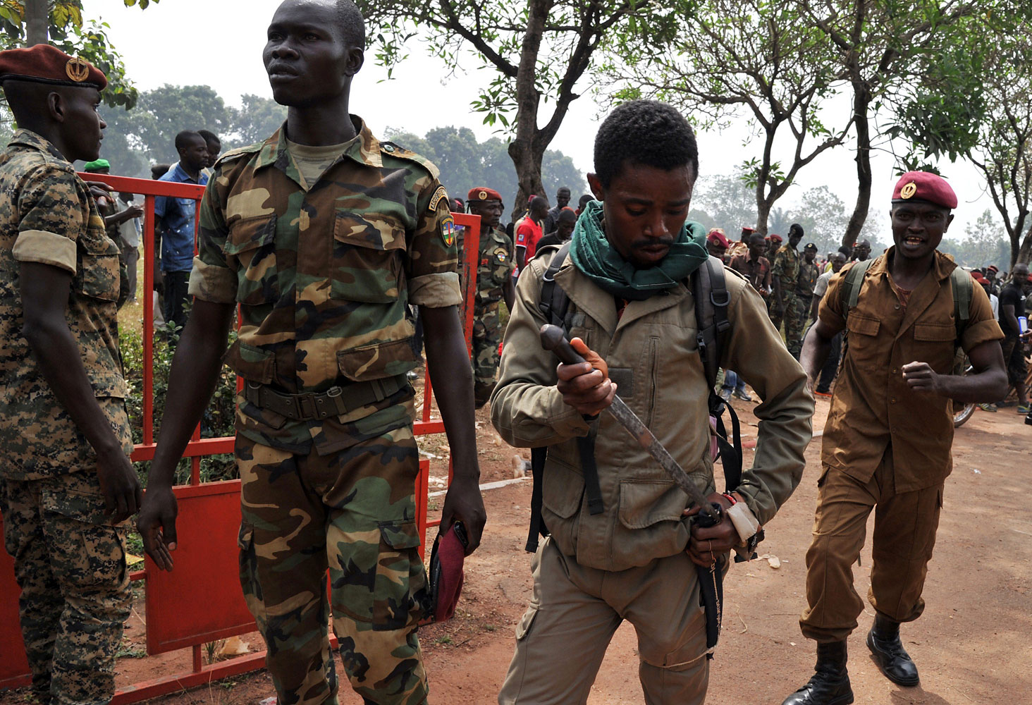 A member of the Central African Armed Forces puts his knife away after taking part in the lynching of a man suspected of being a former Seleka rebel on Feb. 5, 2014, in Bangui.