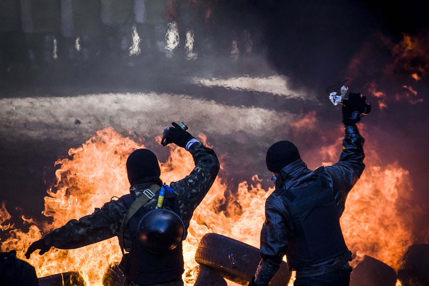 Anti-government demonstrators clash with riot police, Feb. 18, 2014.