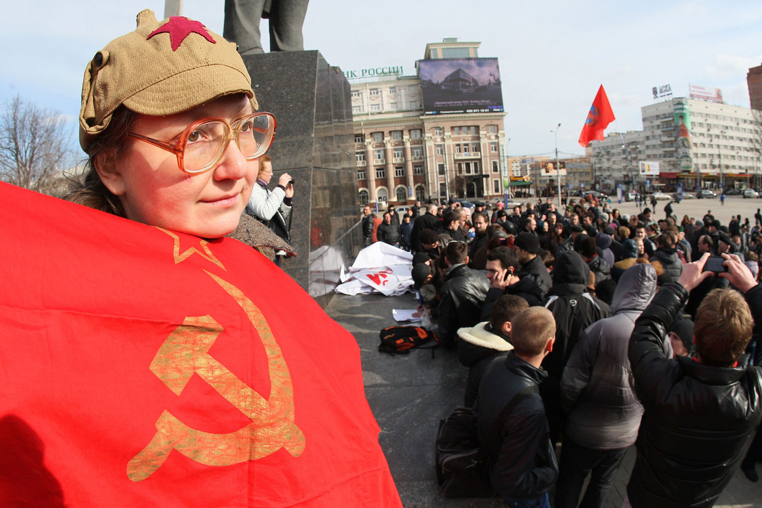 A Ukrainian woman holds a Soviet flag during a rally in the eastern industrial city of Donetsk on Feb. 22, 2014