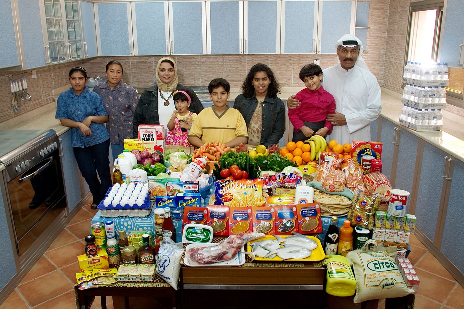 Kuwait: The Al Haggan family of Kuwait City. Food expenditure for one week: 63.63 dinar or $221.45. Family recipe: Chicken biryani with basmati rice.