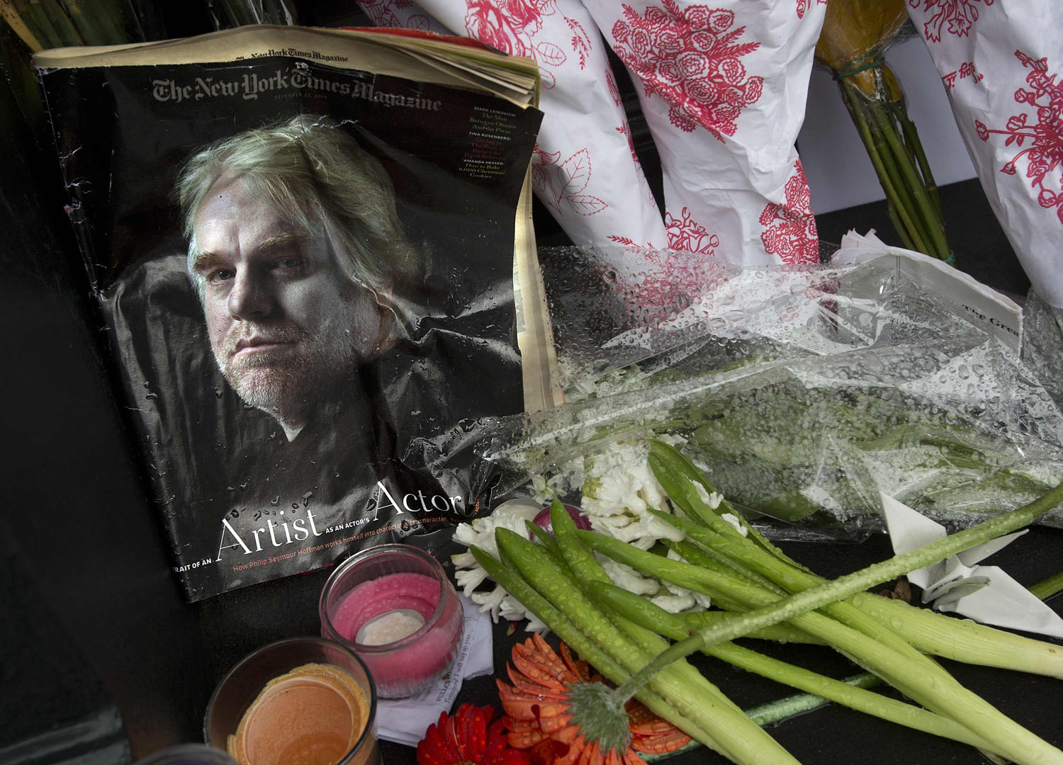A copy of a New York Times Magazine with a photo of movie actor Philip Seymour Hoffman on the cover in a memorial in front of his apartment building in New York City, on Feb. 3, 2014.
