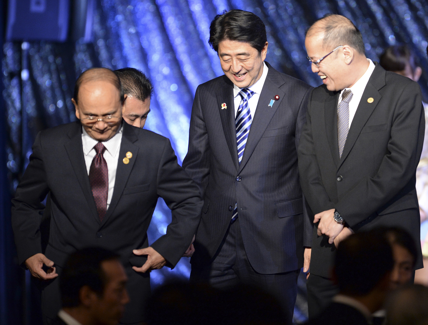 From left, Burma's President Thein Sein, Japan's Prime Minister Shinzo Abe and Philippine President Benigno Aquino III leave the stage during a gala dinner at the ASEAN-Japan Commemorative Summit meeting in Tokyo on Dec. 14, 2013 (POOL New / Reuters)