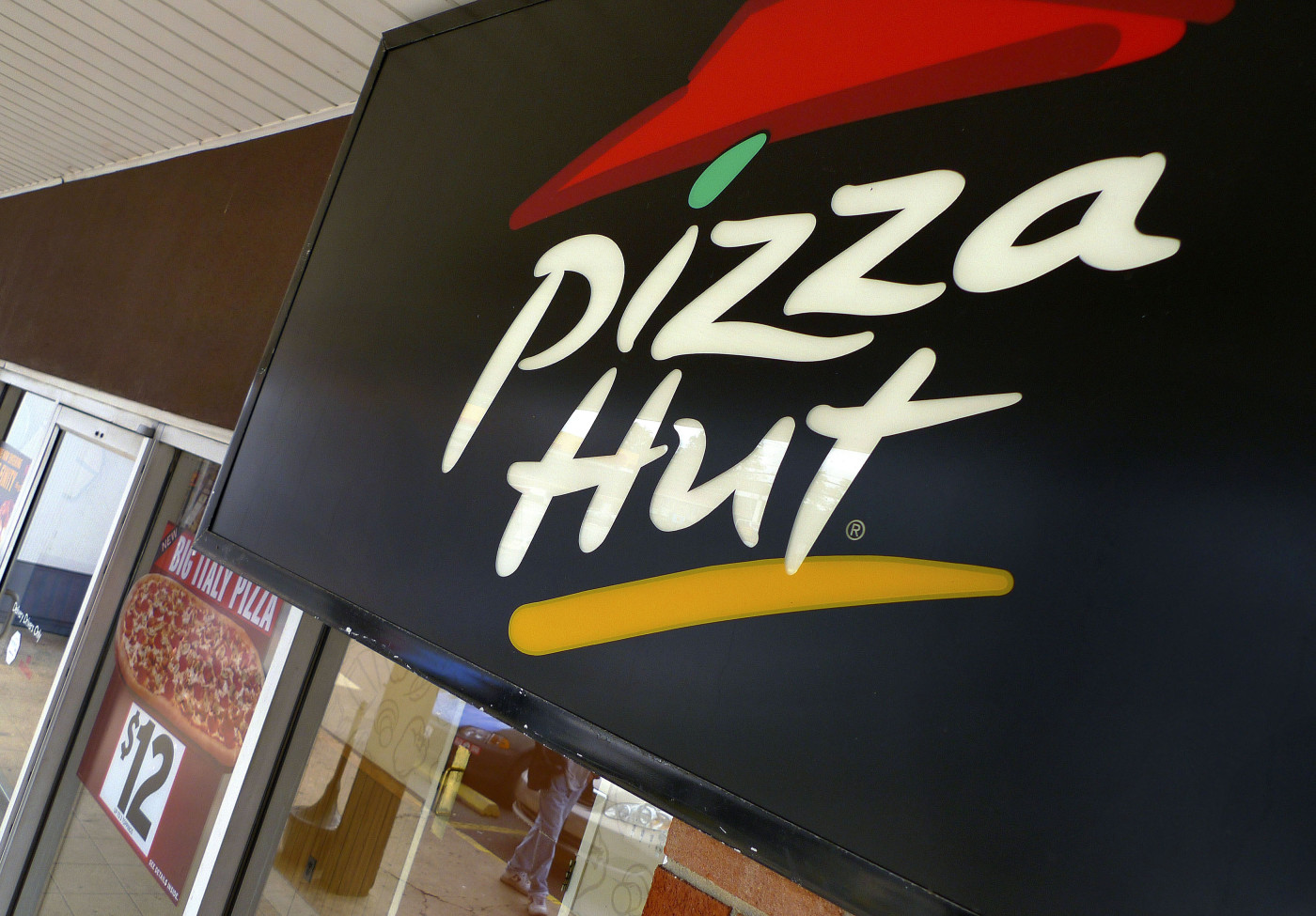 A Pizza Hut logo is pictured outside its restaurant in Vienna