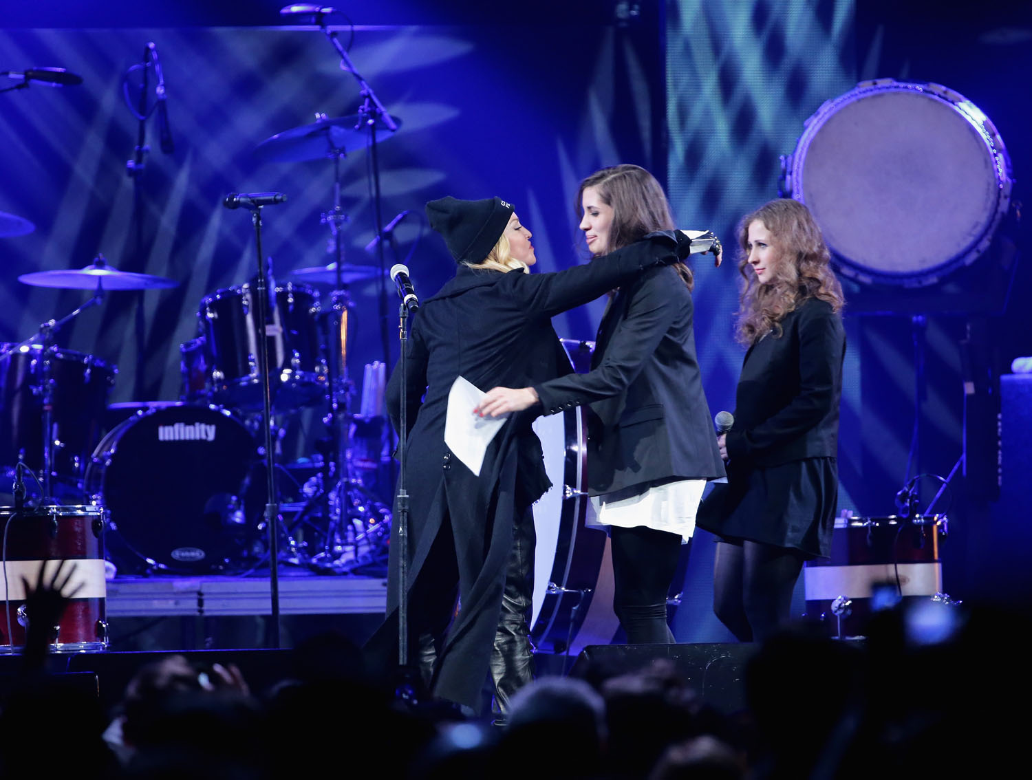 Madonna introduces Nadezhda Tolokonnikova, and Maria Alyokhina, formerly of Pussy Riot, onstage at the Amnesty International Concert presented by the CBGB Festival at Barclays Center on February 5, 2014 in New York City. (Neilson Barnard&mdash;2014 Getty Images)