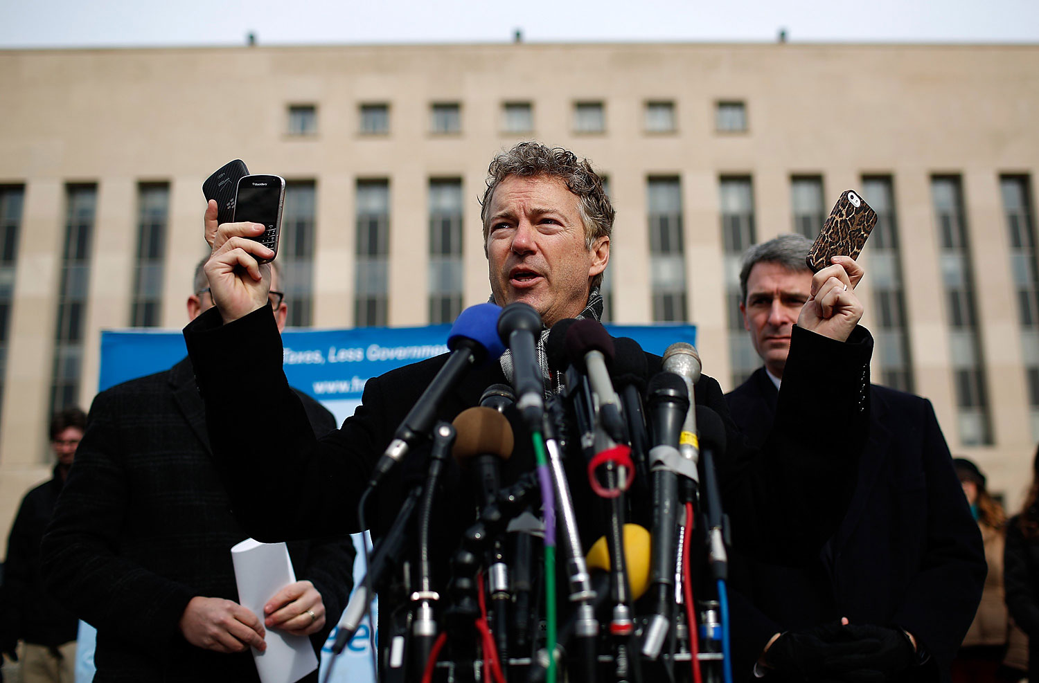 Sen. Rand Paul holds up a group of cell phones in front of U.S. District Court to announce the filing of a class action lawsuit against the administration of U.S. President Barack Obama, Feb. 12. 2014. (Win McNamee&amp;mdash;Getty Images)