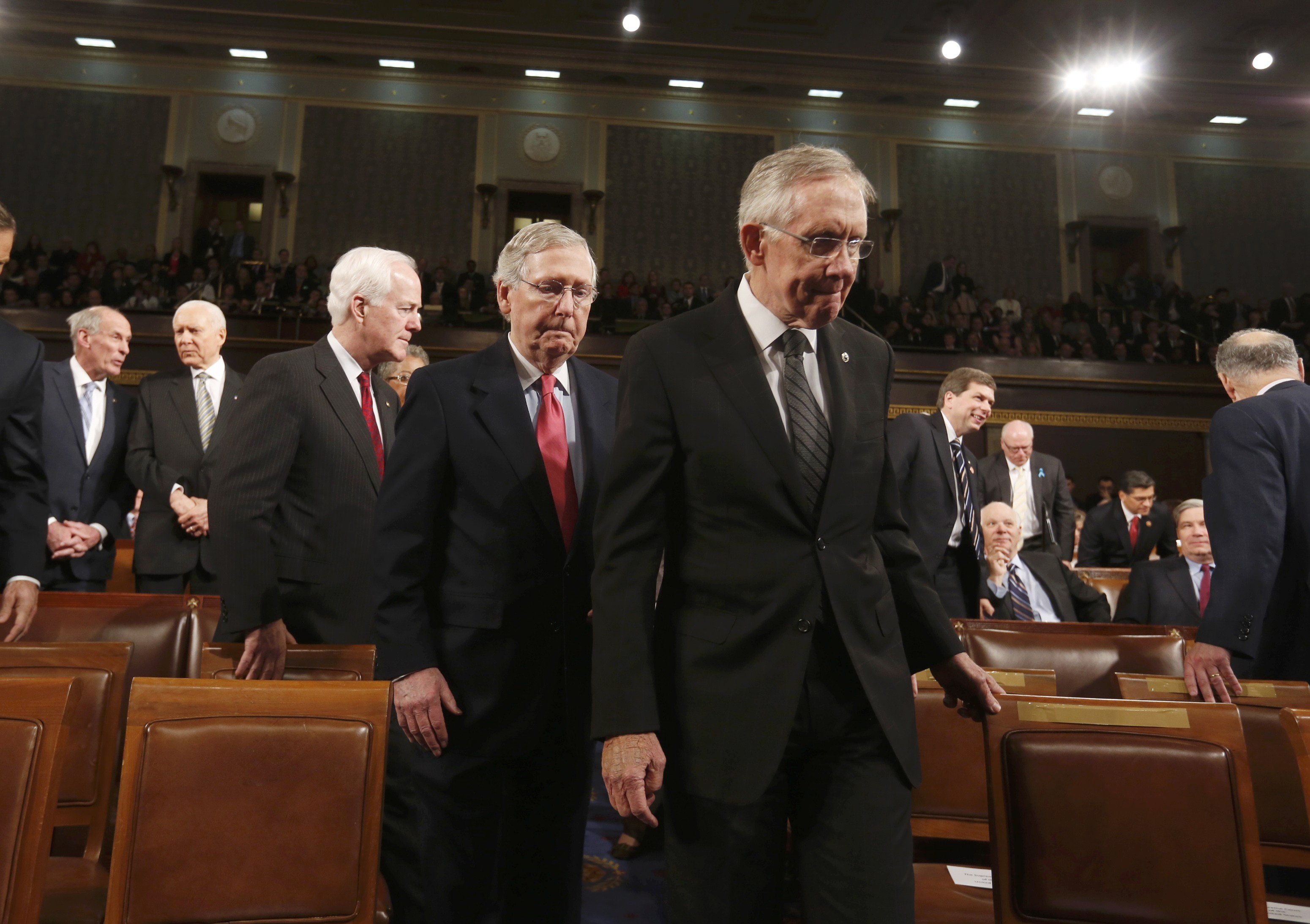 Senate Majority Leader Harry Reid leads Senate Minority Leader Mitch McConnell to the front of the chamber before President Barack Obama delivers his State of the Union speech on Capitol Hill in Washington, January 28, 2014. (Larry Downing—Reuters)