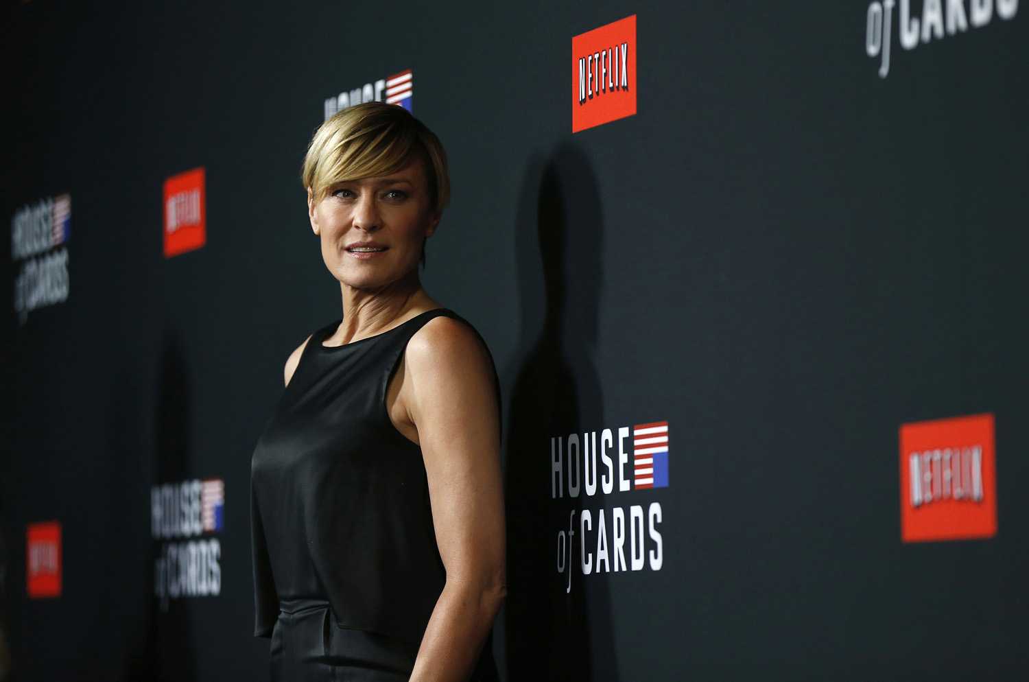 Cast member Robin Wright poses at the premiere for the second season of the television series "House of Cards" at the Directors Guild of America in Los Angeles, California February 13, 2014. Season 2 premieres on Netflix on February 14.