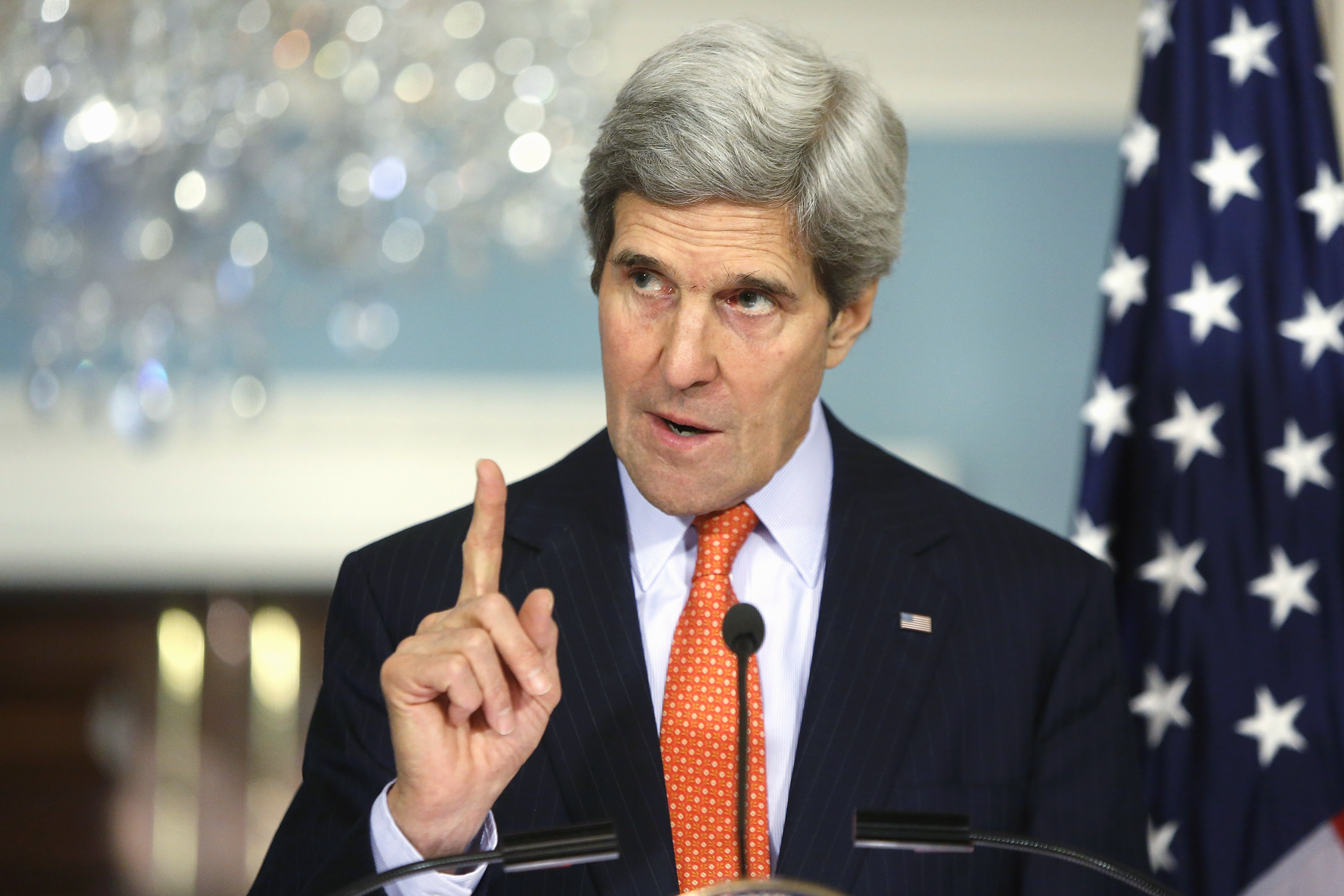 U.S. Secretary of State Kerry gestures as he addresses reporters alongside South Korea's Foreign Minister Yun at the State Department in Washington