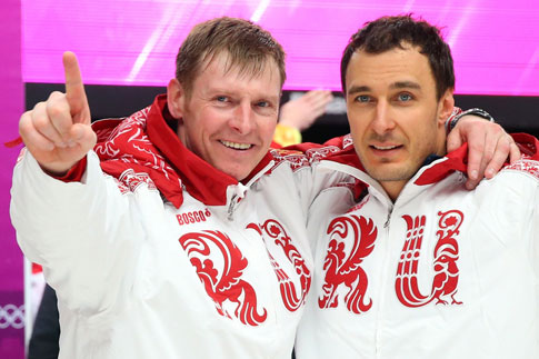 Russian gold medalists Alexander Zubkov, left, and Alexei Voevoda celebrate after winning the two-man bobsleigh event at the Sochi Winter Olympics on Feb. 17, 2014 (Alex Livesey—Getty Images)