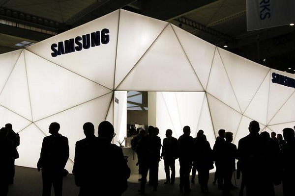 Visitors are seen in front of the Samsung stand during the Mobile World Congress at Barcelona, February 27, 2013.