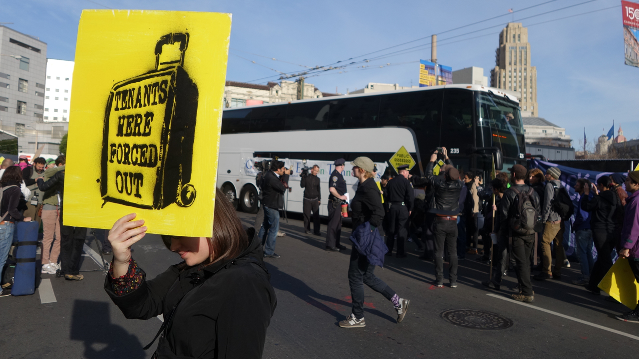 Residents protests rising evictions and rents in San Francisco by blocking two private shuttles transporting tech workers from their homes in San Francisco to their jobs in Silicon Valley on Jan. 21, 2014.