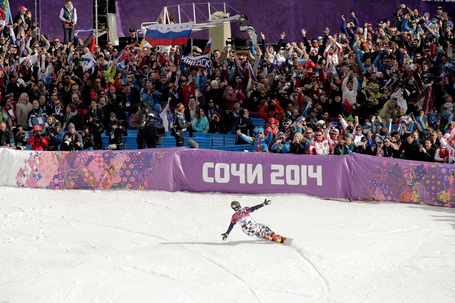 Gold medalist Vic Wild of Russia celebrates in the Snowboard Men's Parallel Slalom Big Final.