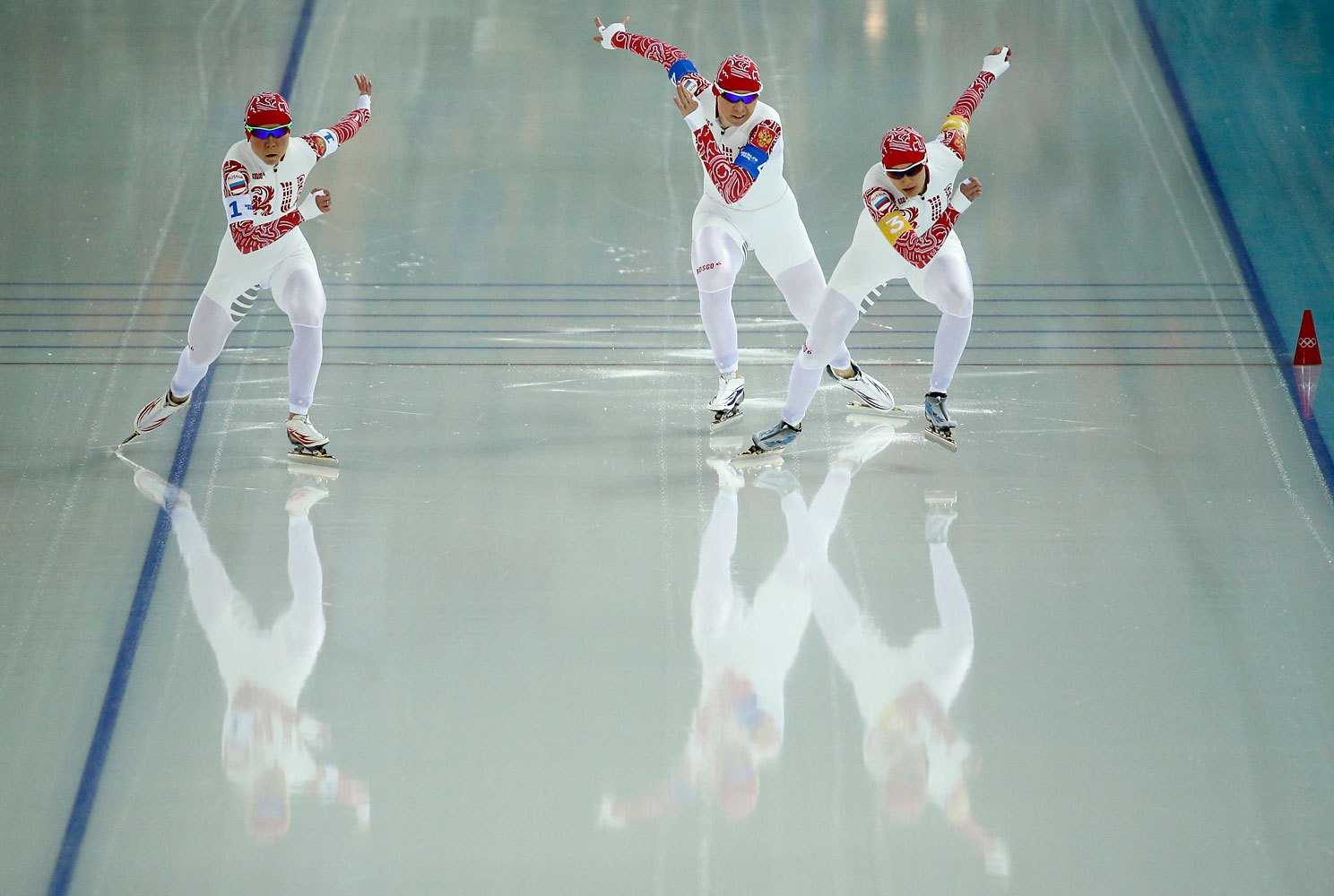 Speedskaters from Russia, left to right, Olga Graf, Yulia Skokova and Yekaterina Shikhova compete in the women's speedskating team pursuit semifinals.