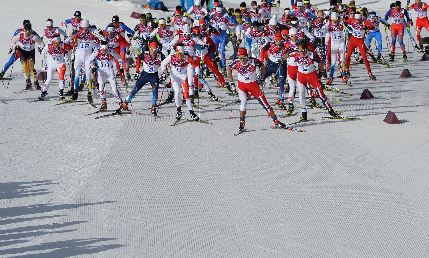 Norway's Chris Andre Jespersen leads the pack after the start of the Men's Cross-Country Skiing 50km Mass Start Free