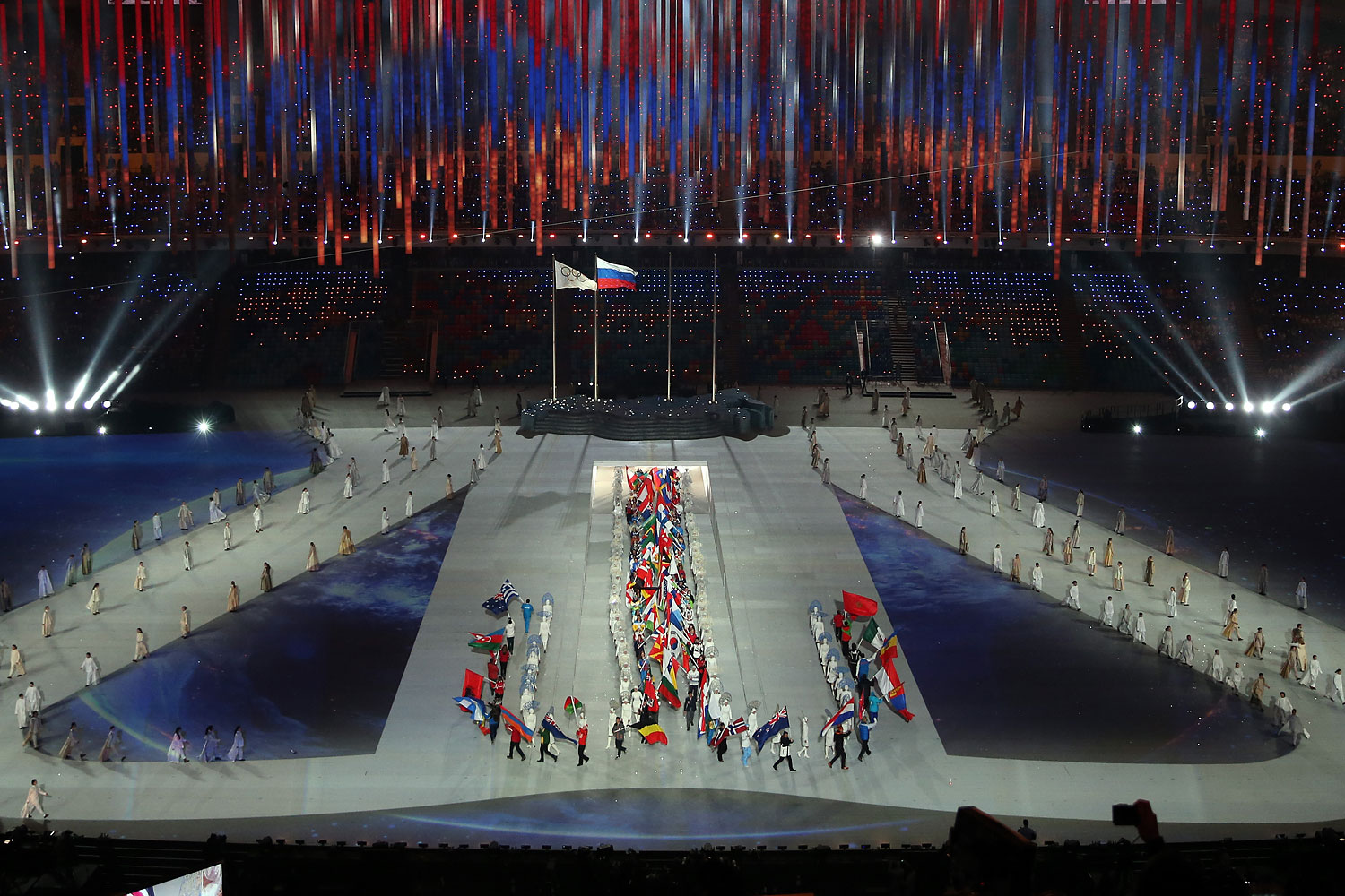 The flags of the competiting nations enter the arena.