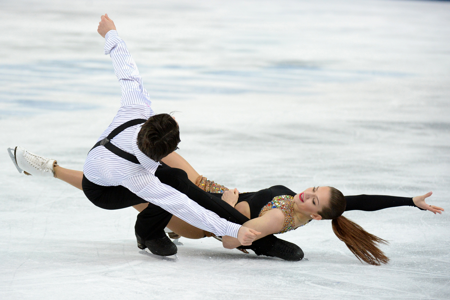 Turkey's Alisa Agafonova and Alper Ucar perform in the Figure Skating Ice Dance Short Dance at the Iceberg Skating Palace during the Sochi Winter Olympics on Feb. 16, 2014.