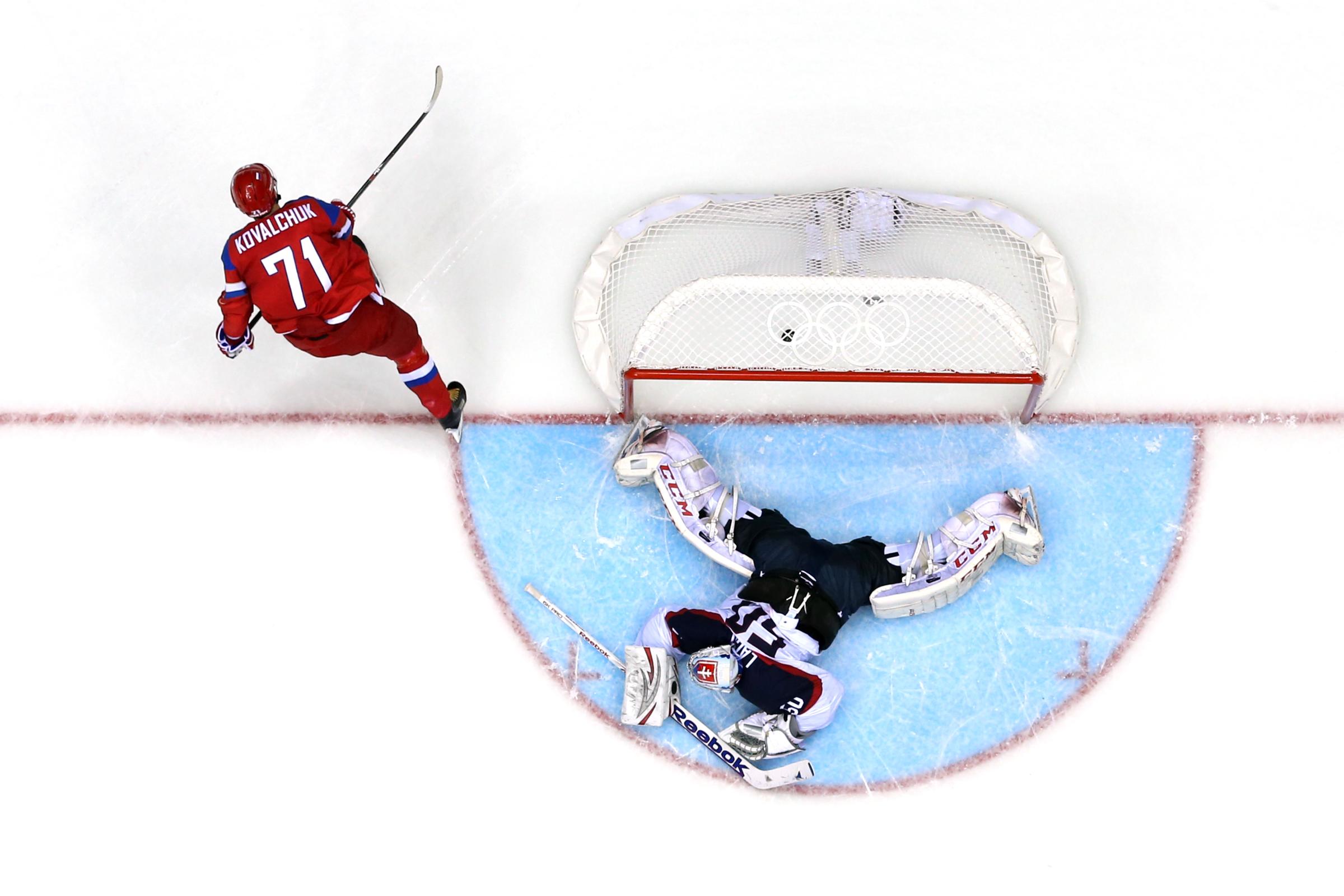 Ilya Kovalchuk #71 of Russia scores a winning goal in a shoot against Jan Laco #50 of Slovakia during the Men's Ice Hockey Preliminary Round Group A game during the Sochi 2014 Winter Olympics at Bolshoy Ice Dome on February 16, 2014 in Sochi, Russia.