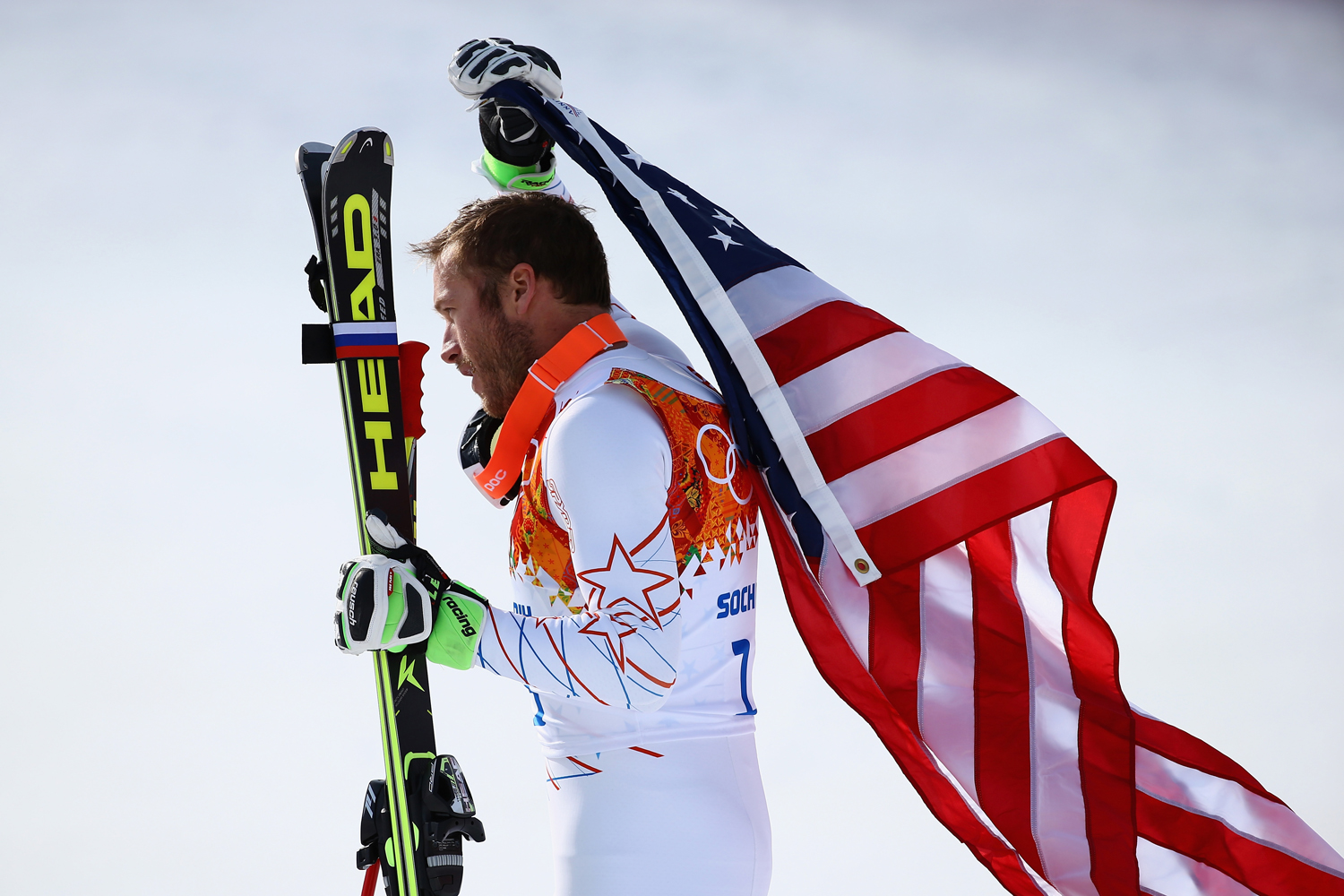 Bronze medalist Bode Miller of the United States reacts during the flower ceremony for the Alpine Skiing Men's Super-G during the Sochi 2014 Winter Olympics at Rosa Khutor Alpine Center on Feb. 16, 2014 in Sochi, Russia.