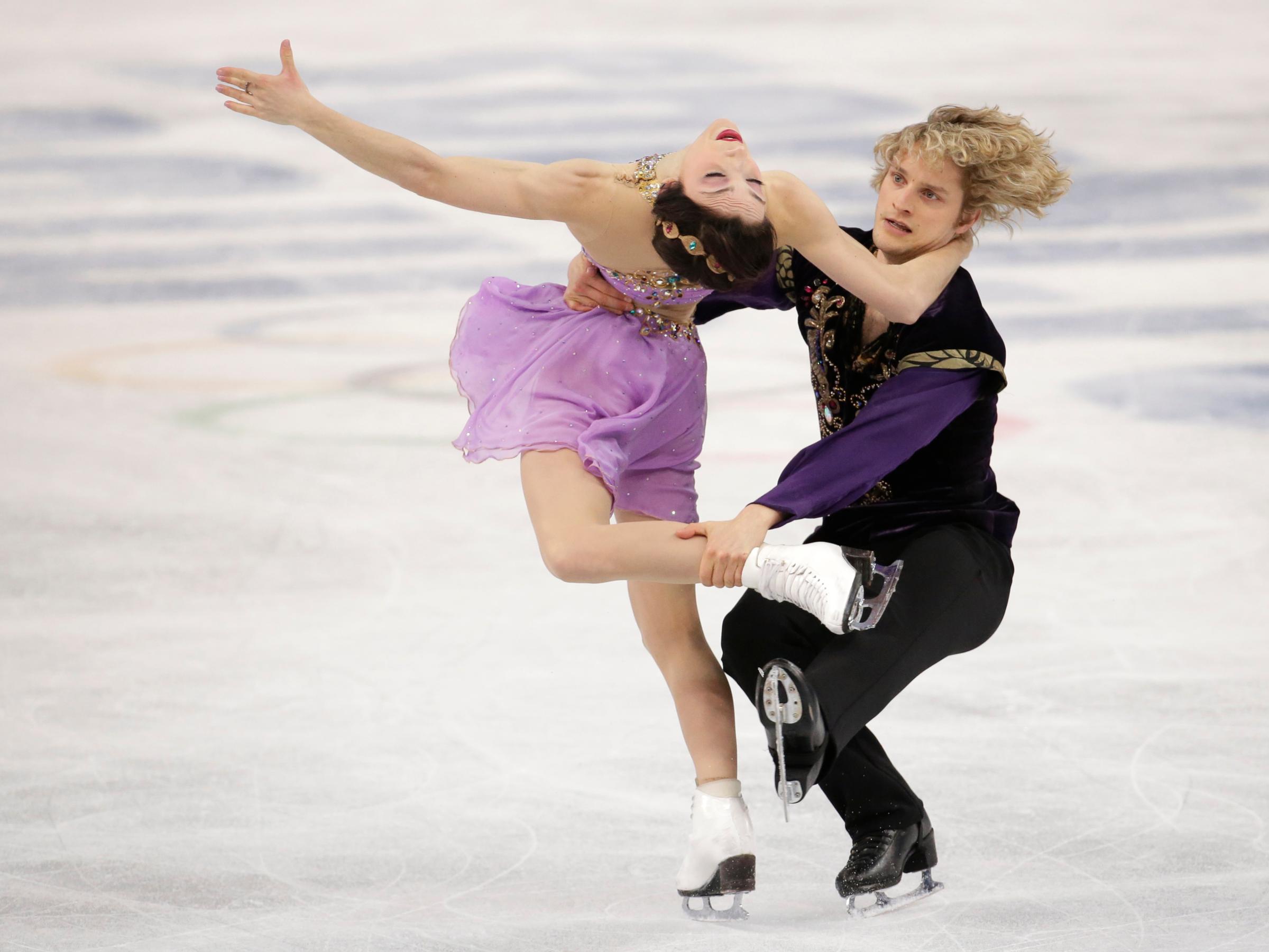 Meryl Davis and Charlie White of the United States compete in the ice dance free dance figure skating finals at the Iceberg Skating Palace.