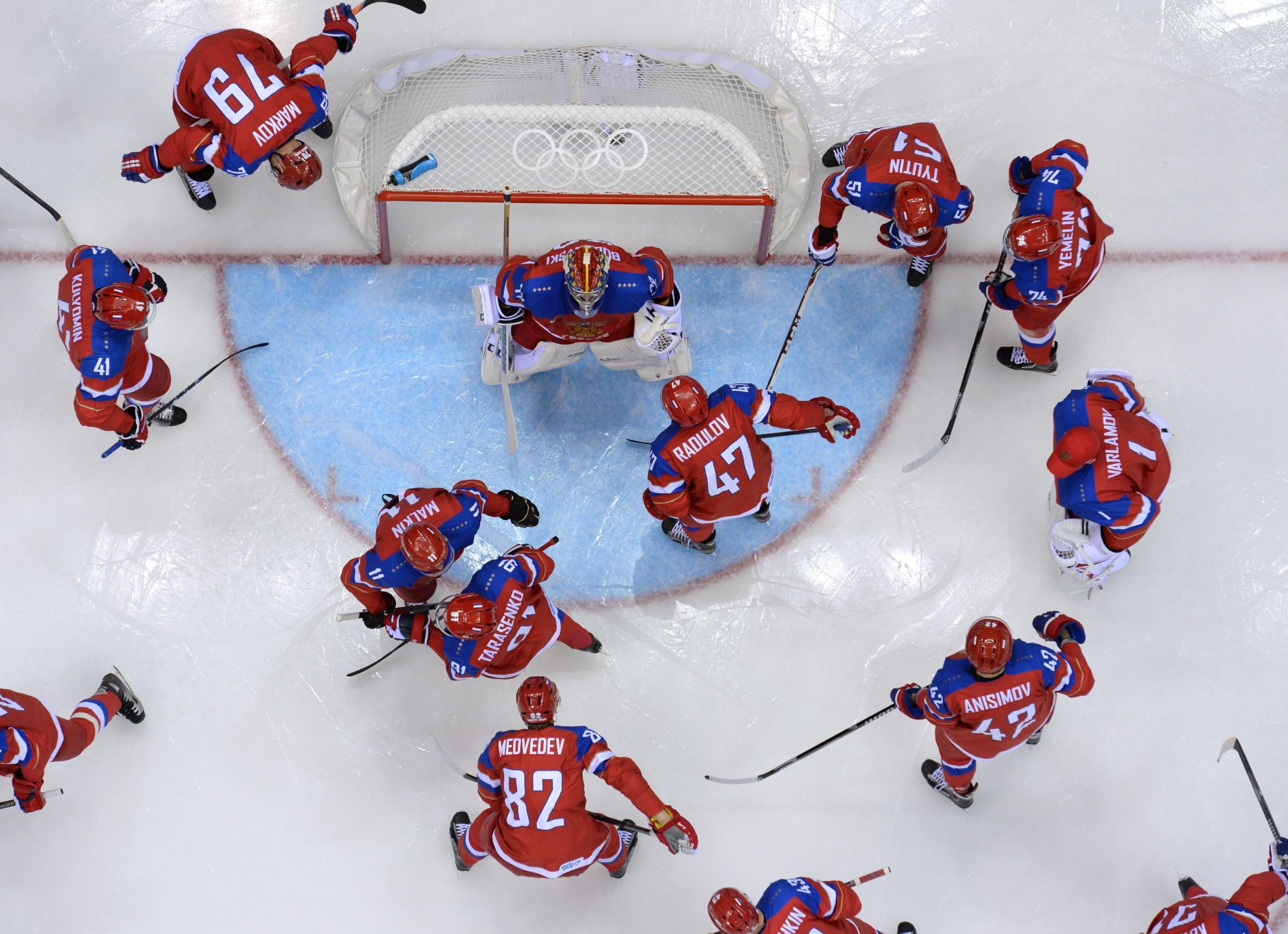 Russia's players gather before the start of the Men's Ice Hockey play-offs qualification match Russia vs Norway at the Bolshoy Ice Dome.