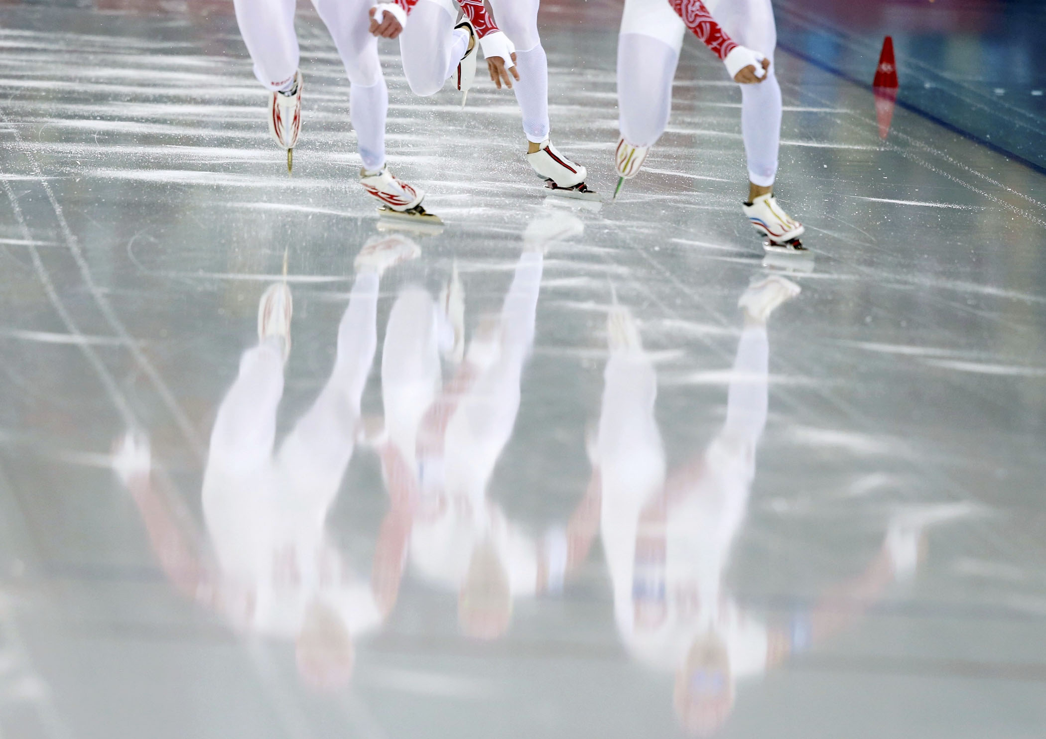 Russia's skaters start during their men's speed skating team pursuit quarter-finals event.