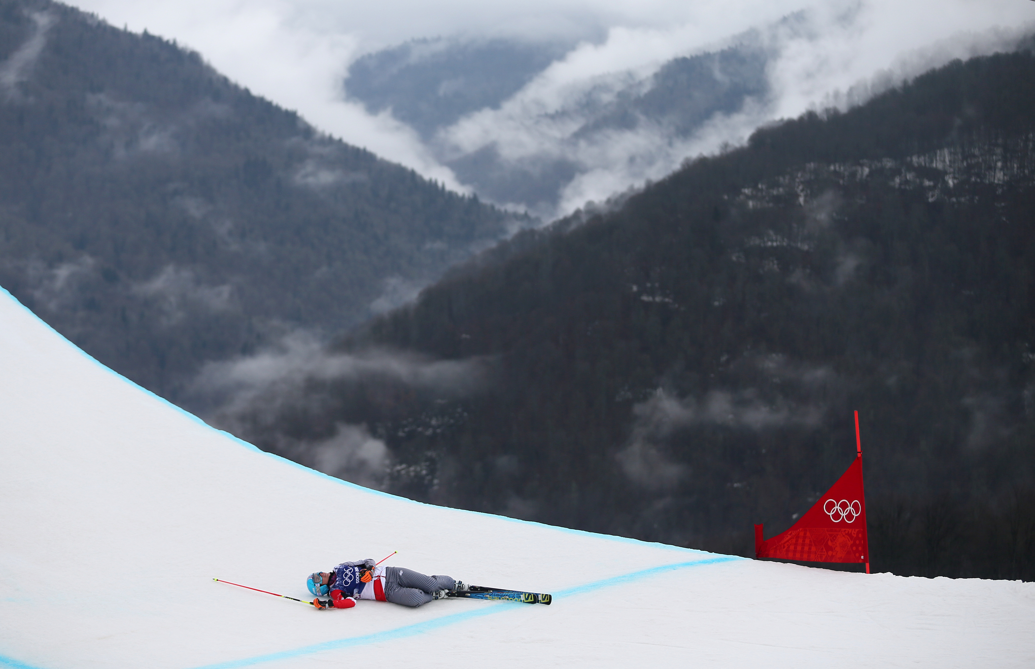 Karolina Riemen-Zerebecka of Poland reacts after falling during the Quarterfinal of the women's Freestyle Ski Cross event.
