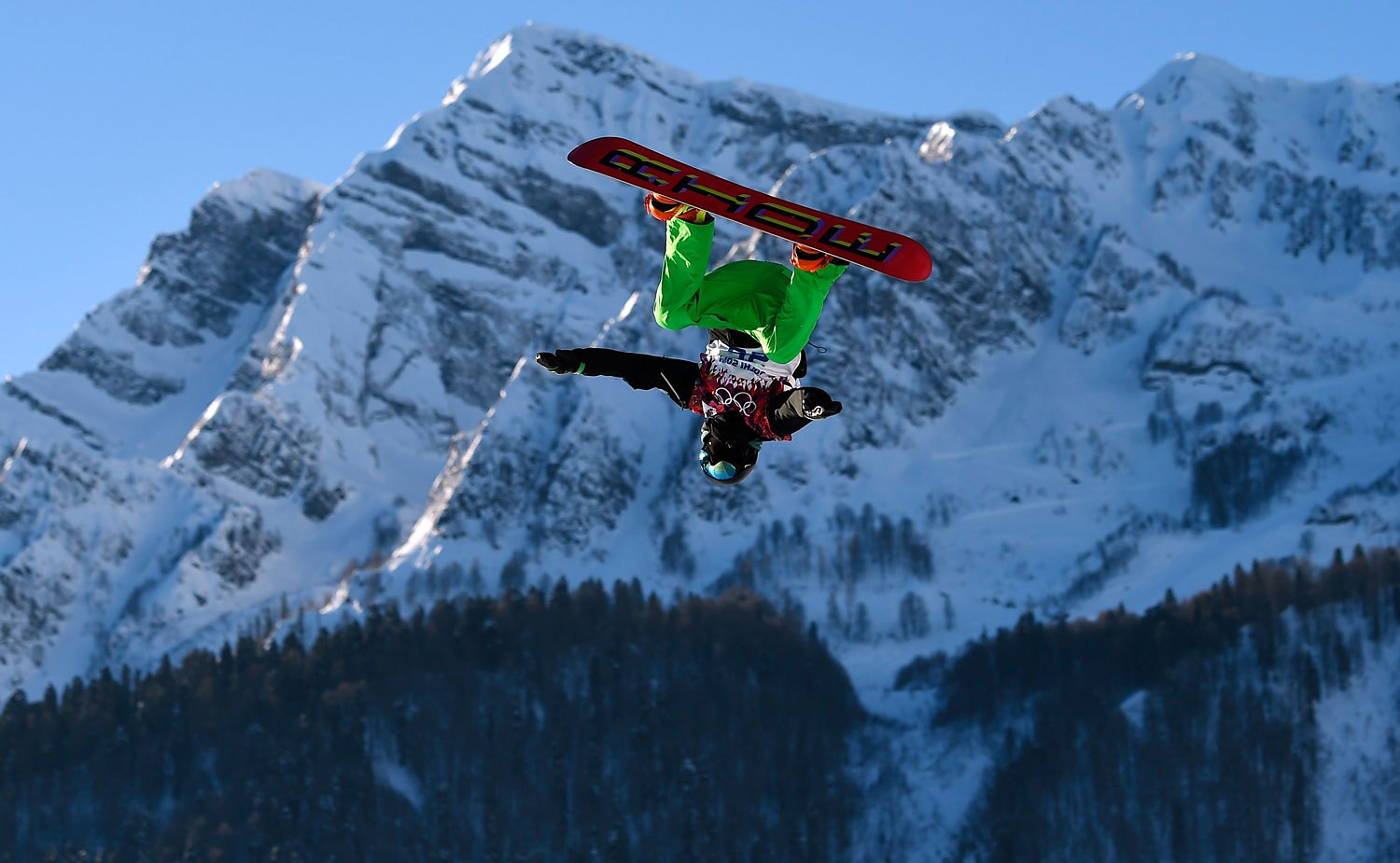 Ireland's Seamus O'Connor performs a jump during the men's snowboard slopestyle semi-final competition in Rosa Khutor, Feb. 8, 2014.