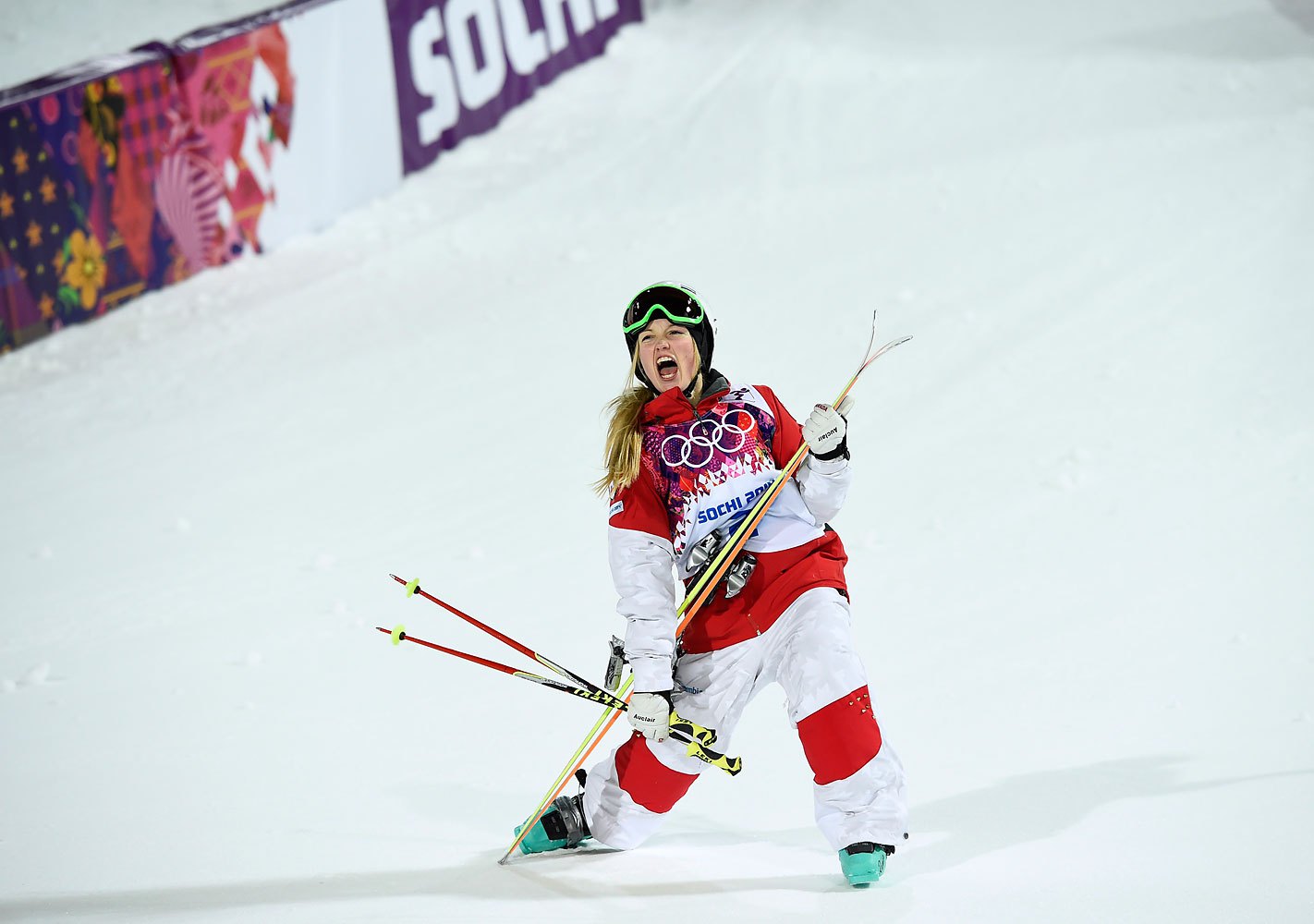 Canada's Justine Dufour-Lapointe celebrates after winning the women's freestyle skiing moguls final competition, Feb. 8, 2014.