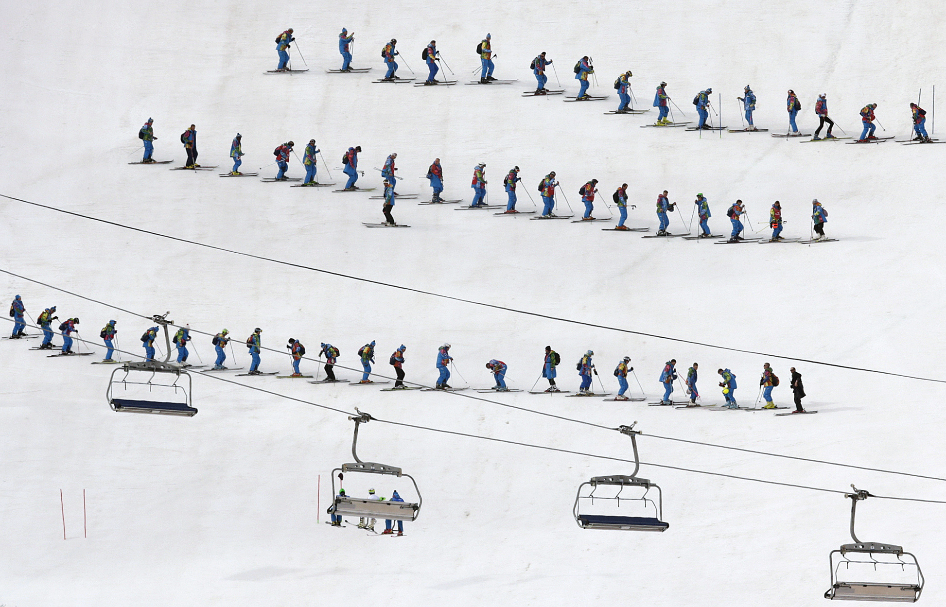 Slippers prepare the course ahead of the slalom portion of the men's supercombined.