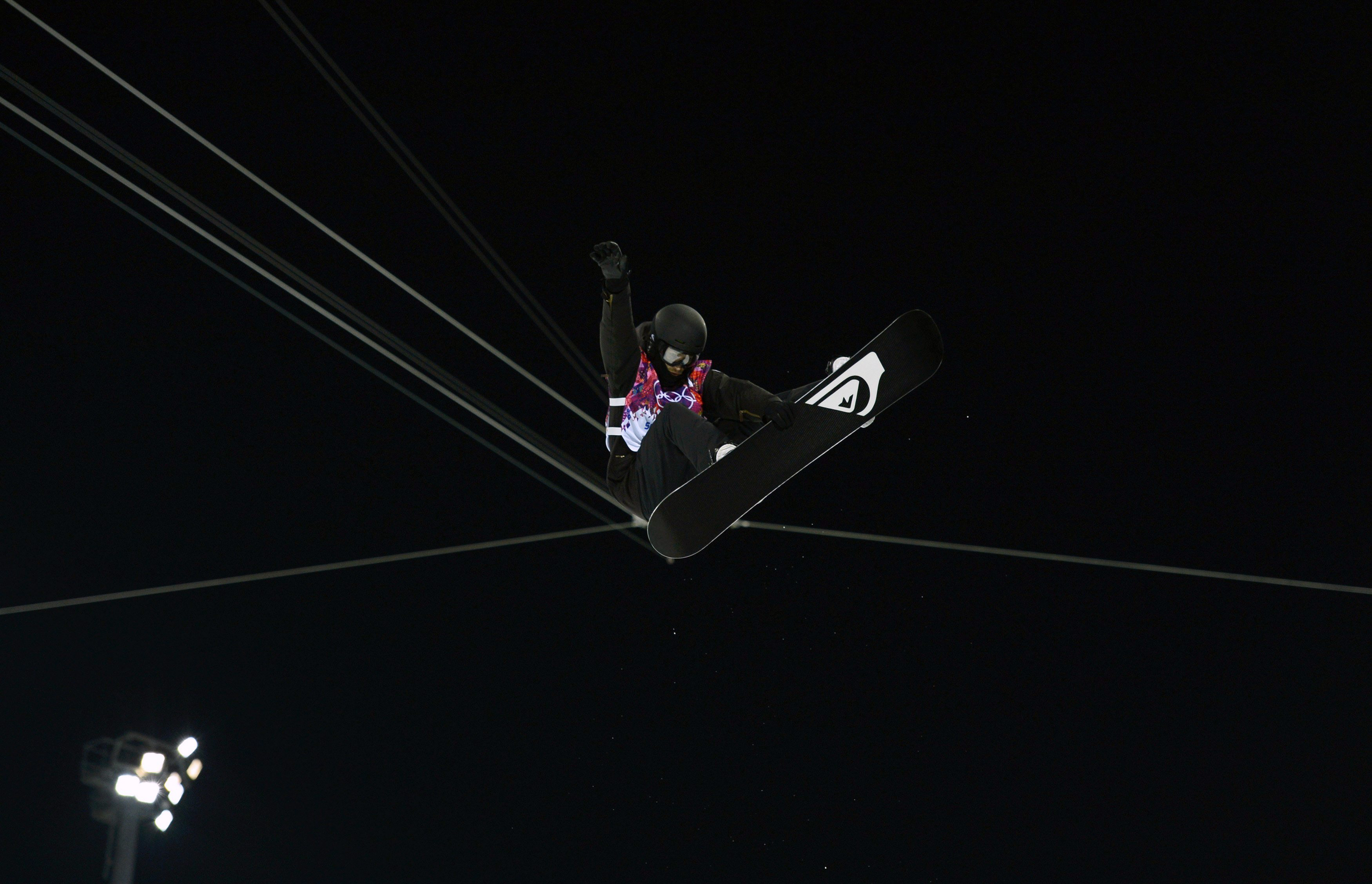 Switzerland's Iouri Podladtchikov performs a jump during the men's snowboard halfpipe semi-final even.
