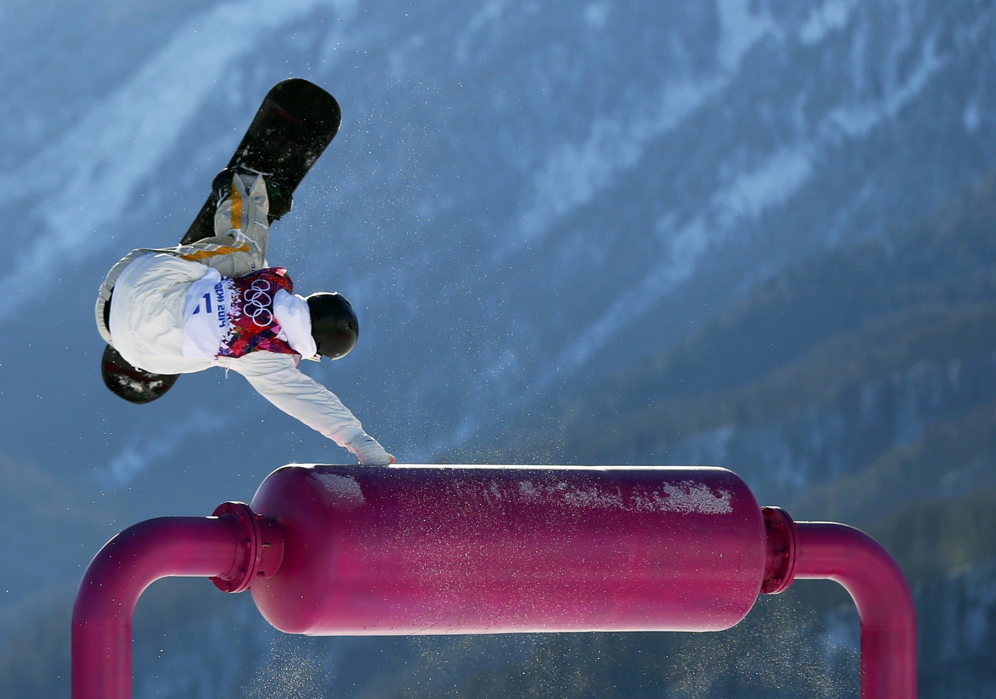 Sweden's Niklas Mattsson performs a jump during the men's slopestyle snowboarding qualifying session at the 2014 Sochi Olympic Games in Rosa Khutor, February 6, 2014.