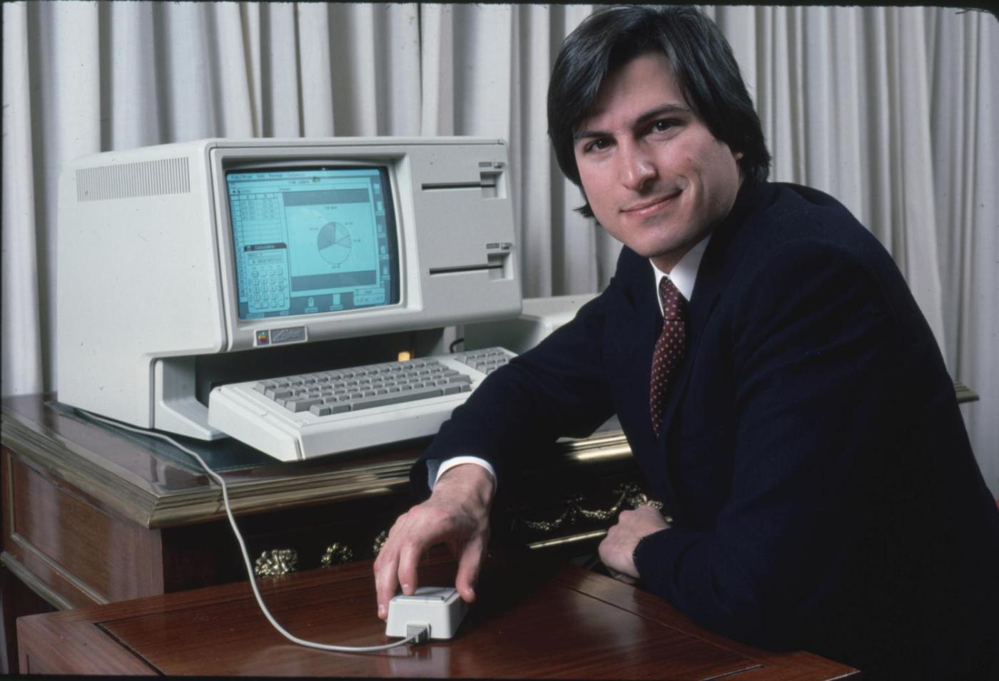 Steve Jobs poses with the Lisa computer during a 1983 press preview.