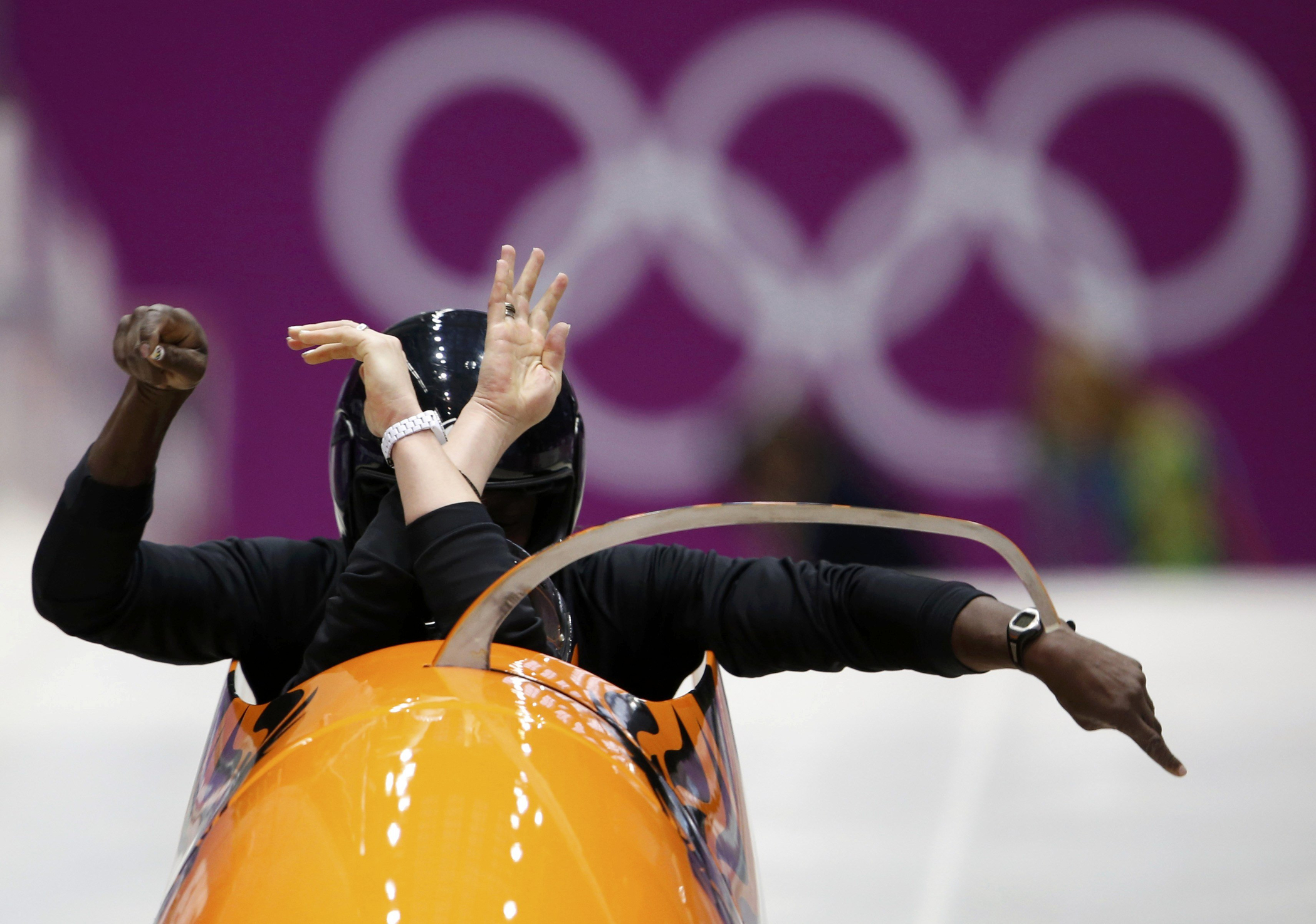 Pilot Esme Kamphuis (front) of the Netherlands starts a two-women bobsleigh training event at the Sanki Sliding Center in Rosa Khutor, a venue for the Sochi 2014 Winter Olympics, near Sochi, Feb. 14, 2014.