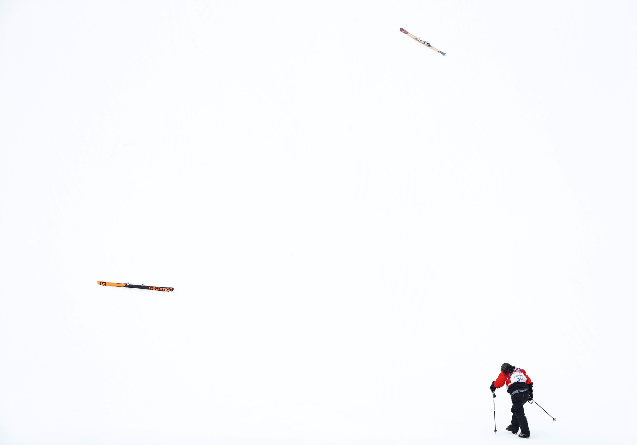 Paraguay's Julia Marino walks towards her skis after crashing during the women's freestyle skiing slopestyle qualification event at the 2014 Sochi Winter Olympic Games in Rosa Khutor Feb. 11, 2014.