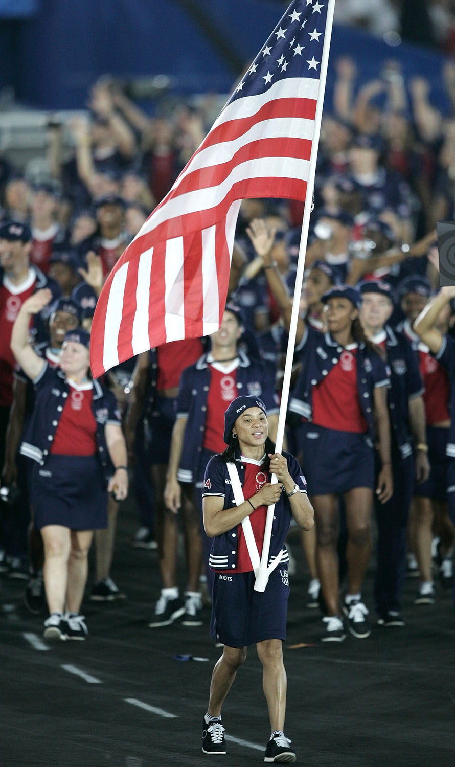 Basketball athlete Dawn Staley carries the U.S. national flag during the opening ceremony of the Athens 2004 Olympic Games.